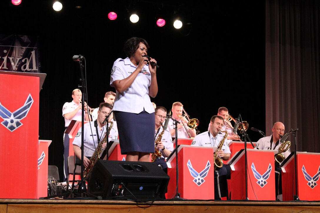 Technical Sergeant Keisha Gwin-Goodin, vocalist with the "Shades of Blue" Jazz Ensemble grooves as she sings "Lover Man", a jazz standard originally written for legendary vocalist Billie Holiday. "Shades of Blue" played three concerts throughout the four day jazz festival hosted by the University of Wisconsin-Eau Claire. 