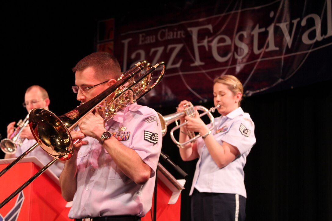Staff Sergeant's Ben Peterson, Erik Dahlgren, and Brenna Dooley (from l-r) concentrate as they play "A Nightingale Sang in Berkeley Square" at the University of Wisconsin-Eau Claire's Jazz Festival. SSgt Dahlgren, bass trombonist, played a solo on the tune throughout his final tour with the "Shade's of Blue Jazz Ensemble". 