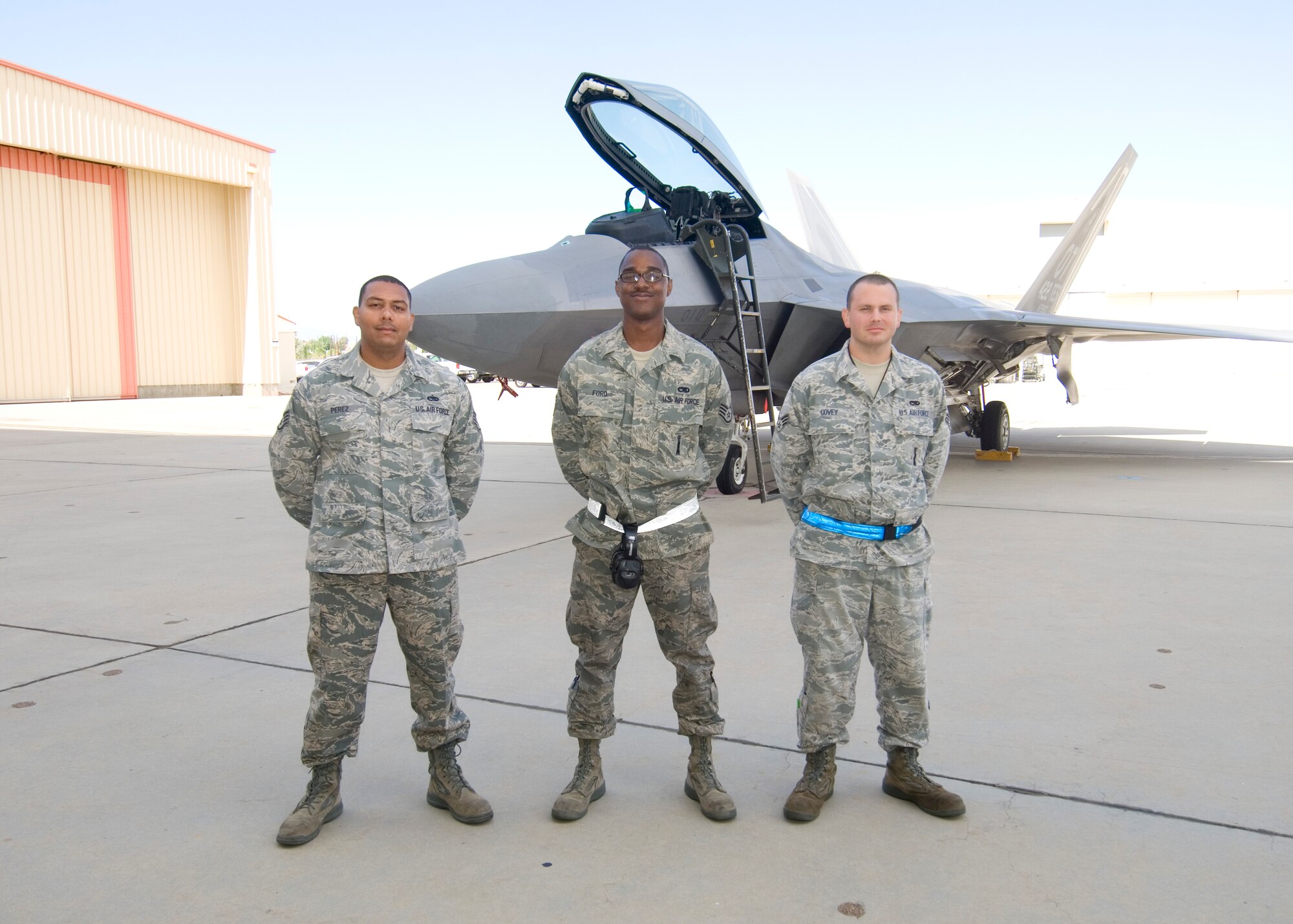 First quarter weapons load competition winners: F-22 load crew (left to right): Staff Sgt. Alexe Perez, Staff Sgt. Marcel Ford and Senior Airman Douglas Covey. (Air Force photo by Edward Cannon)