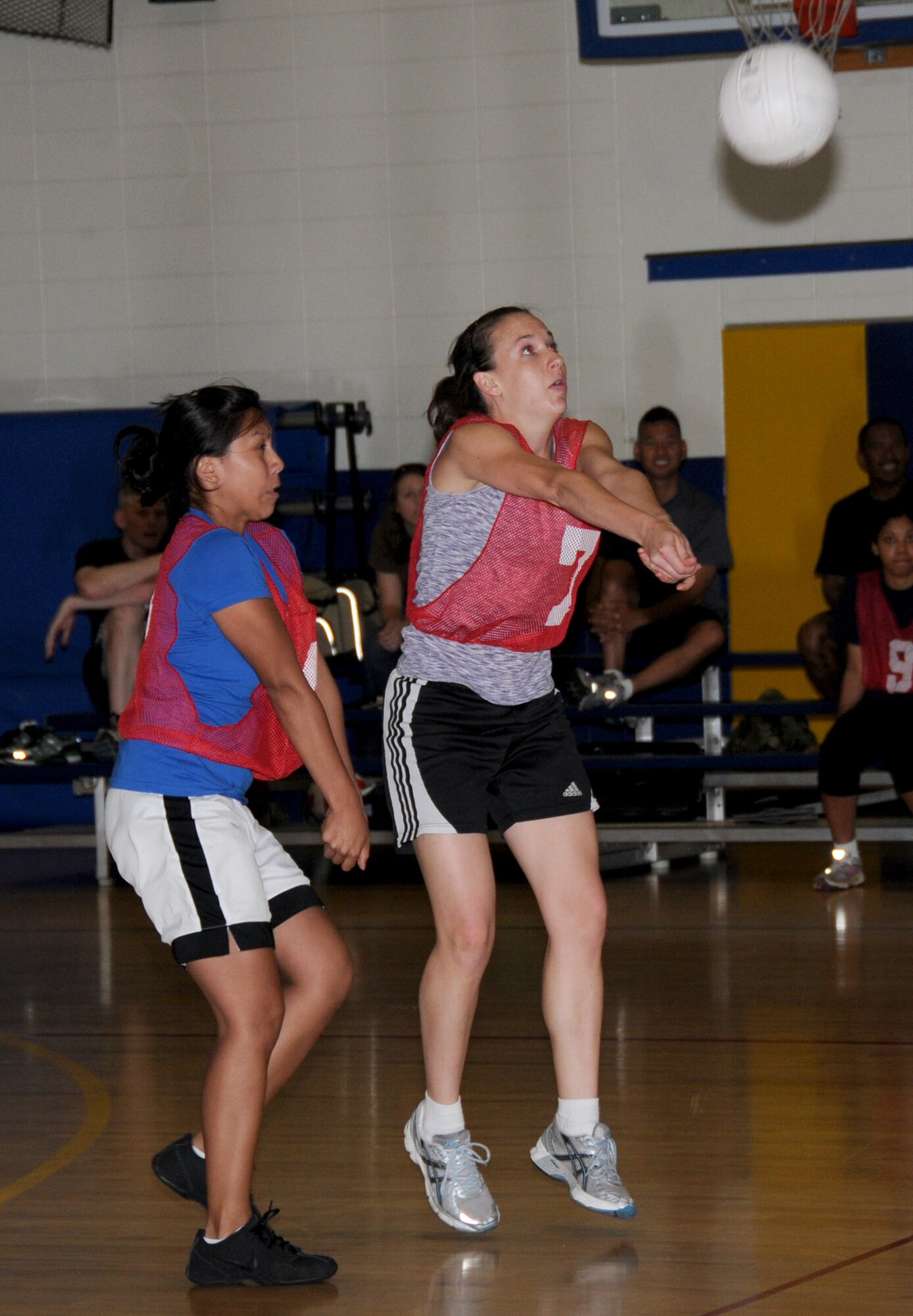 Candace Thompson, left, backs up 81st MDTS teammate Lauren Hedlund during
Monday’s opening round game against the 338th TRS. The 81st MDTS won, 2-0.  (U.S. Air Force photo by Kemberly Groue)