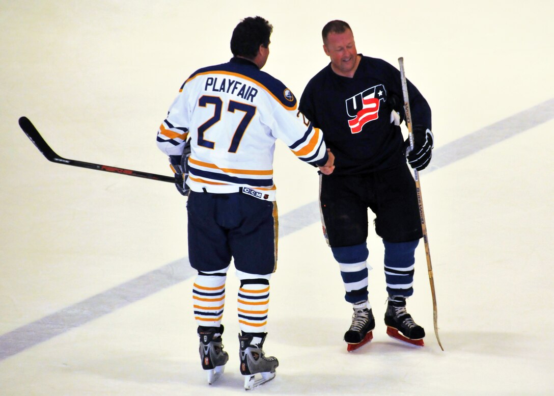 The Buffalo Sabres Alumni Team play hockey against The Niagara Falls Air Reserve Station Team April 10, 2011 at the Niagara University Campus Dwyer Arena Niagara Falls NY.  Proceeds from the game will benefit The Family Readiness Units of the 914th and 107th units based at the Niagara Falls Air force Base. (U.S. Air Force photo by Staff Sgt. Joseph McKee)