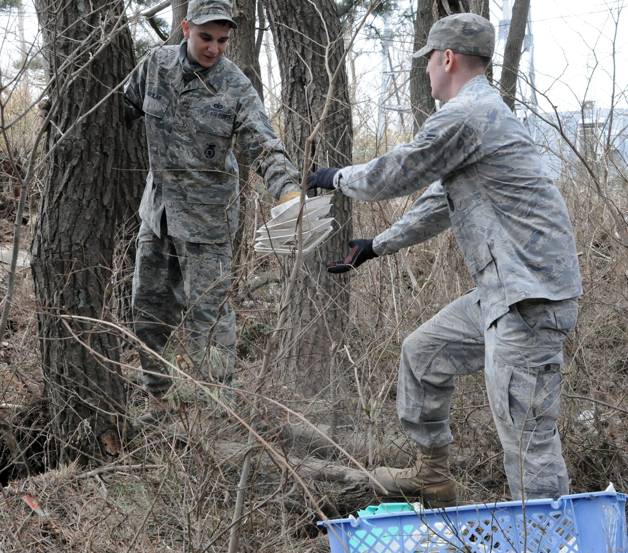 Airmen collect debris April 7, 2011, during a humanitarian relief mission in Hachinohe, Japan. The Airmen are assigned to the 35th Security Forces Squadron at Misawa Air Base, Japan. (U.S. Air Force photo/Staff Sgt. Erica Picariello)