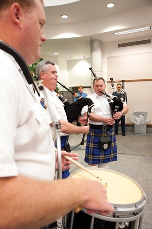 From left, John Guerry plays the snare drum, and Tim French and John Weed play the bagpipes. The three SPAWAR Systems Center Atlantic employees are also part of Charleston's Scottish Marching Band associated with the Charleston Police Station. The 45-member group is made up of police officers and volunteers who perform in many events along the eastern shores of the United States and Canada. (U.S. Navy photo/Joe Bullinger)