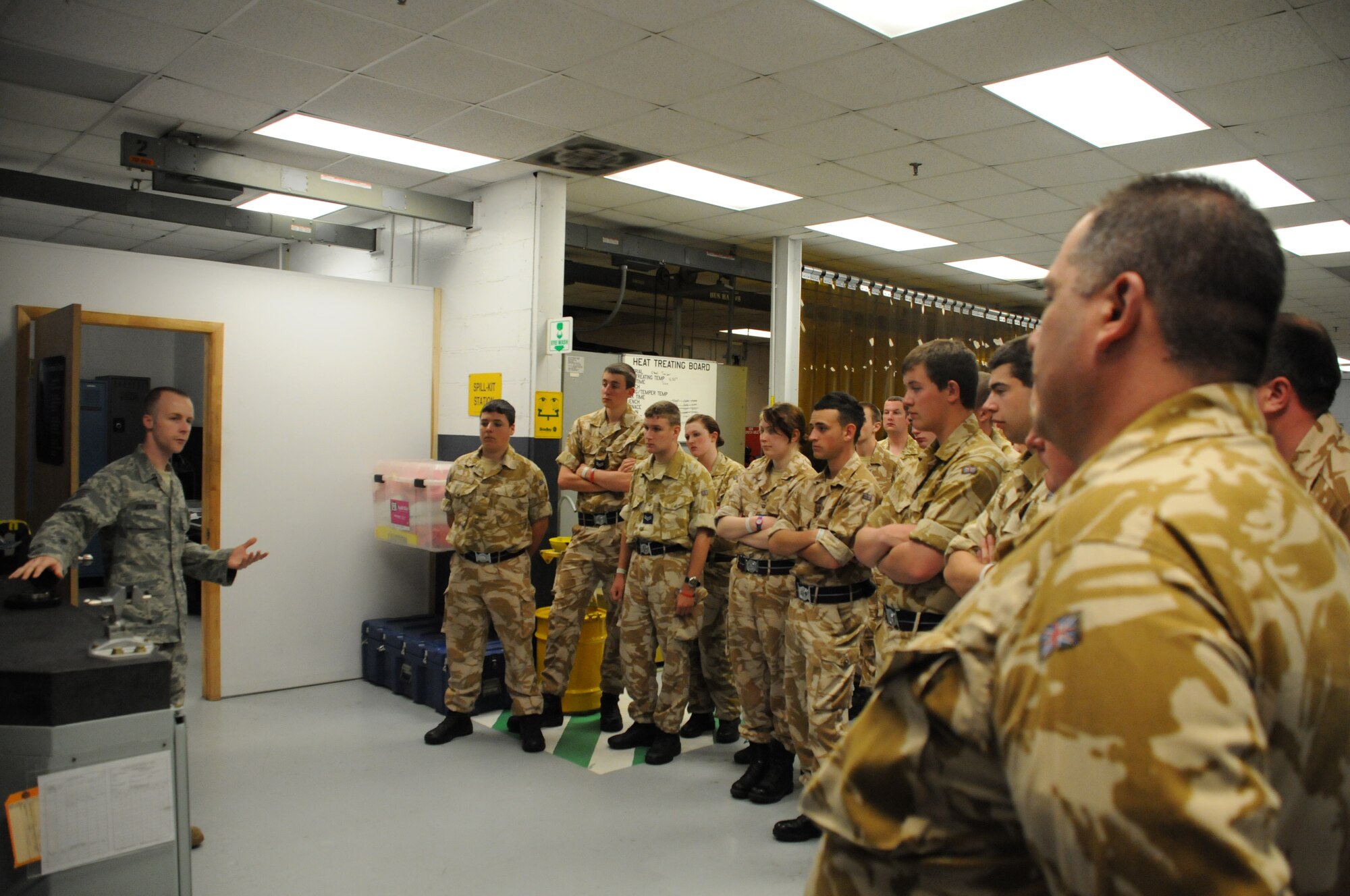 MacDill Air Force Base, Fla. --  Staff Sgt. Michael Johnston, an aircraft metals technology machinist, briefs 15 visiting cadets and seven staff members from the British Royal Air Force Cadets program.  Johnston, a native of Orlando, Fla., demonstrated the Air Force's ability to use computers to reverse engineer aircraft parts no longer in production. The cadets and staff spent the day on MacDill learning about the United States Air Force Reserve. 