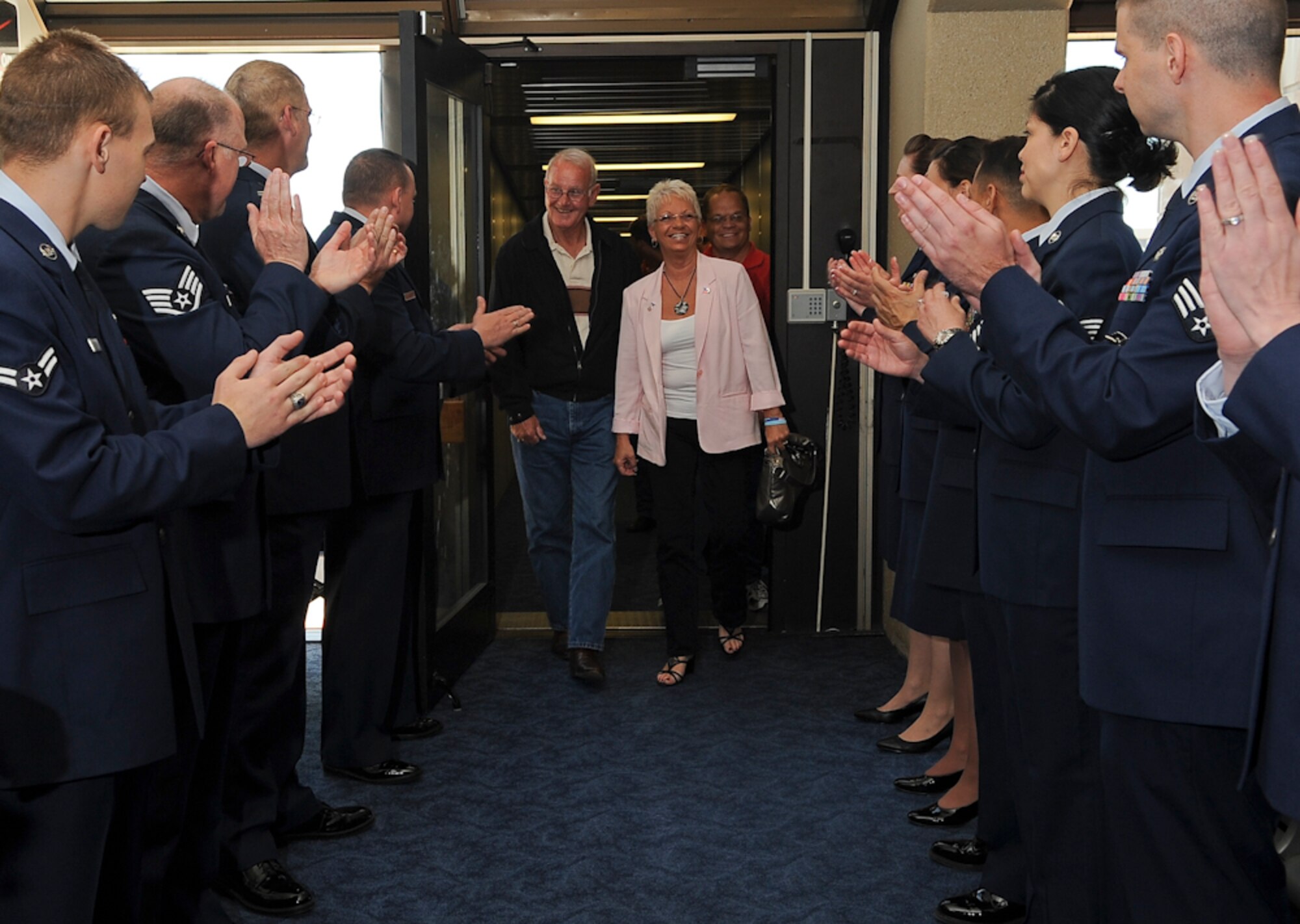 Army Command SGT Major (ret) Robert M. Patterson, Vietnam Medal of Honor recipient and his wife are welcomed by members of the 136th Airlift Wing, texas Air National Guard at DFW Airport, Dallas, Texas, April 5, 2011 for the annual MOH Parade. Sergeant Patterson received his MOH citation on Nov. 17, 2010, 41 years after the heroic act. (U.S. Air Force photo by Senior Master Sgt. Elizabeth Gilbert)