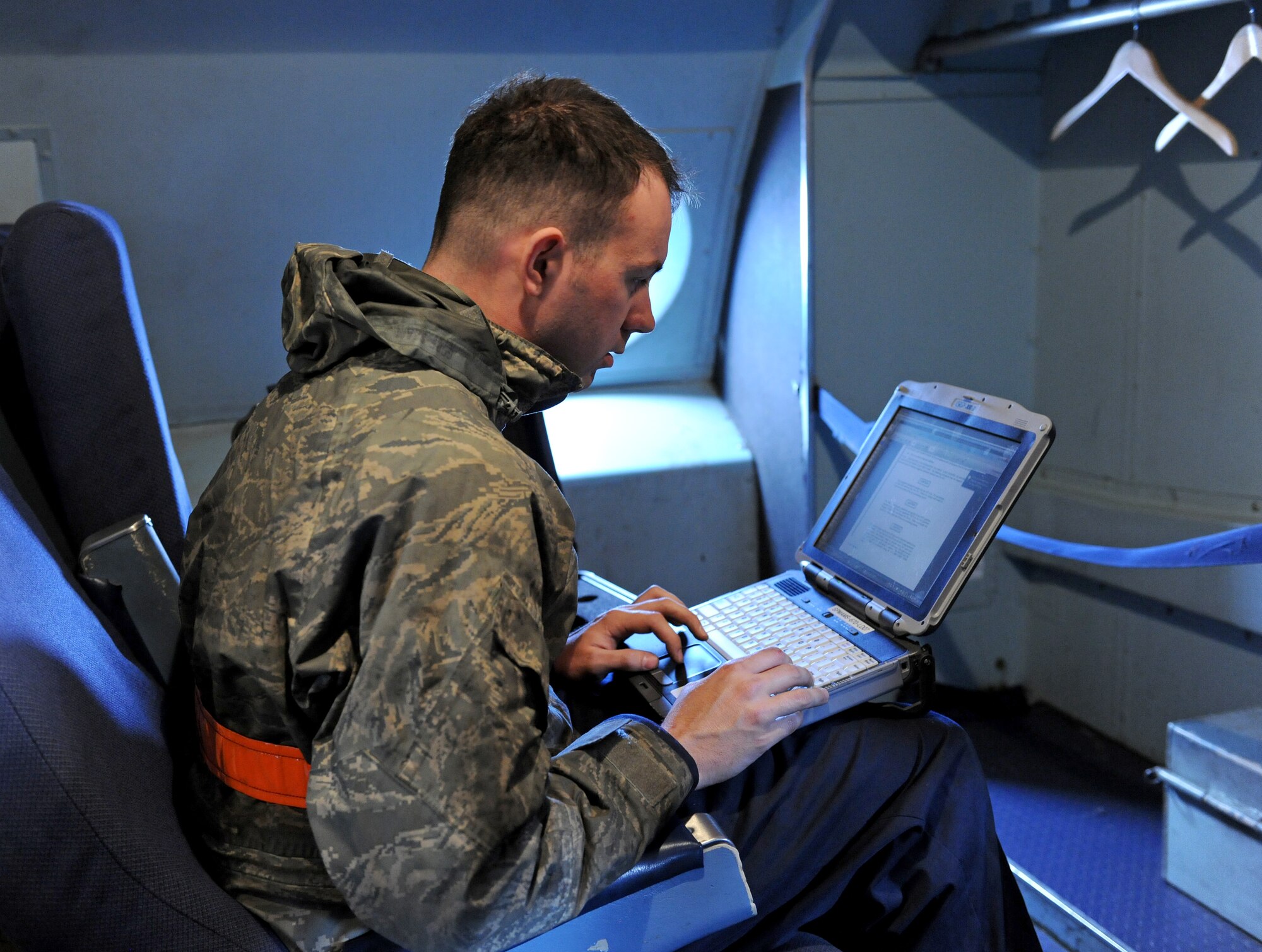 SPANGDAHLEM AIR BASE, Germany – Senior Airman Joel Ireland, 726th Air Mobility Squadron integrated avionics journeyman, reviews a technical order prior to loading a worldwide navigation database on a C-5 Galaxy here April 12. The database contains maps and reference points around the world, allowing aircrews to plan flight routes from the cockpit. The 726th AMS supports the overseas Air Mobility Command mission.  (U.S. Air Force photo/Senior Airman Nathanael Callon)