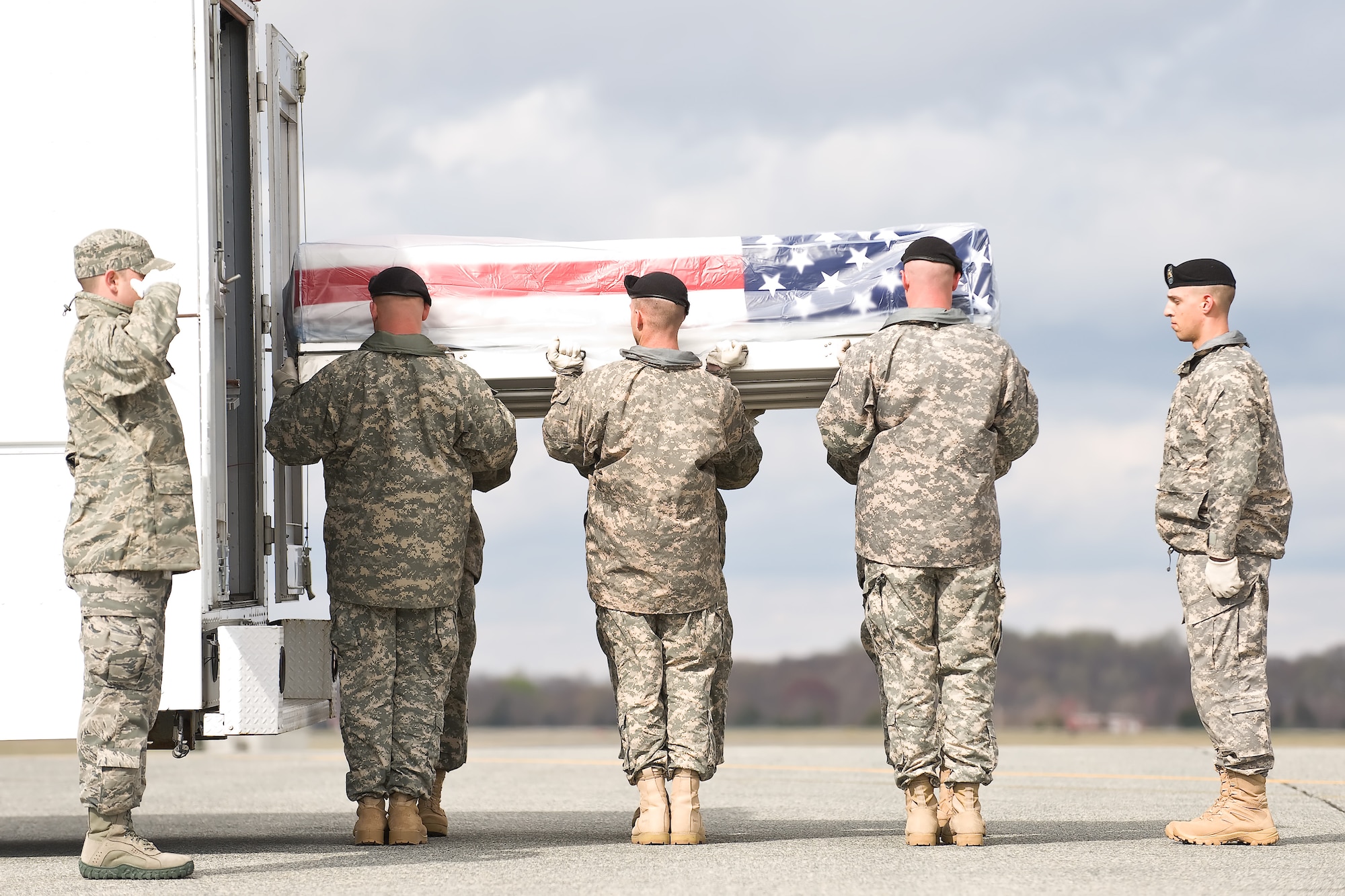 A U.S. Army carry team transfers the remains of Army Staff Sgt. Quadi S. Hudgins, of New Orleans, La., at Dover Air Force Base, Del., April 5, 2011. Hudgins was assigned to Fort Hood, Texas. (U.S. Air Force photo/Roland Balik)