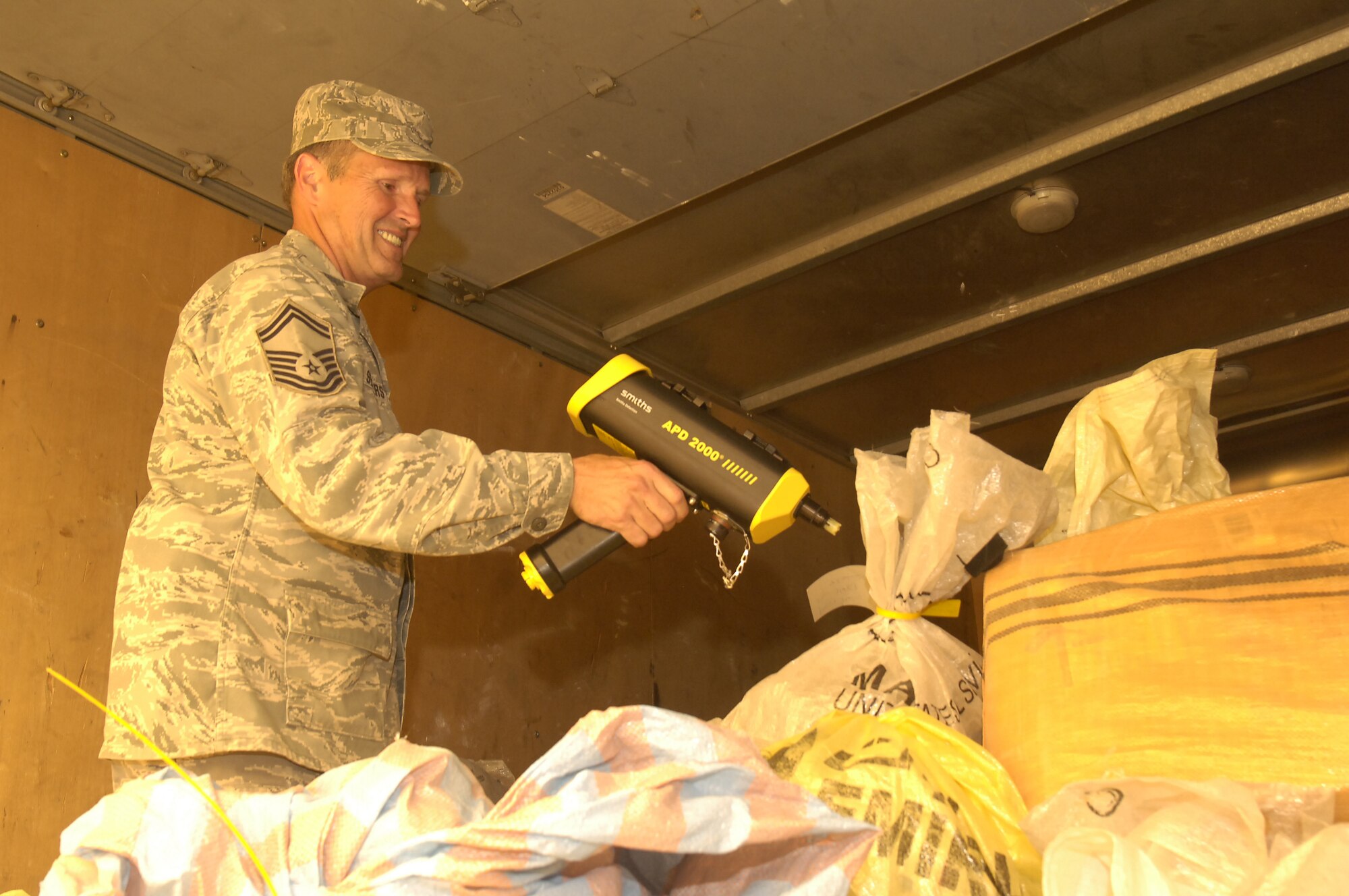 VICTORY BASE COMPLEX, Iraq -- Senior Master Sgt. Douglas Senters, 447th Expeditionary Civil Engineer Squadron emergency management superintendant, scans a mail truck from downtown Baghdad, Iraq, for chemical and radiological contamination April 12 before it is distributed to servicemembers on the Victory Base Complex. Sergeant Senters is originally from Randolph, Ohio, and is deployed from Youngstown Air Reserve Station, Ohio. (U.S. Air Force photo by Tech. Sgt. Randy Redman)
