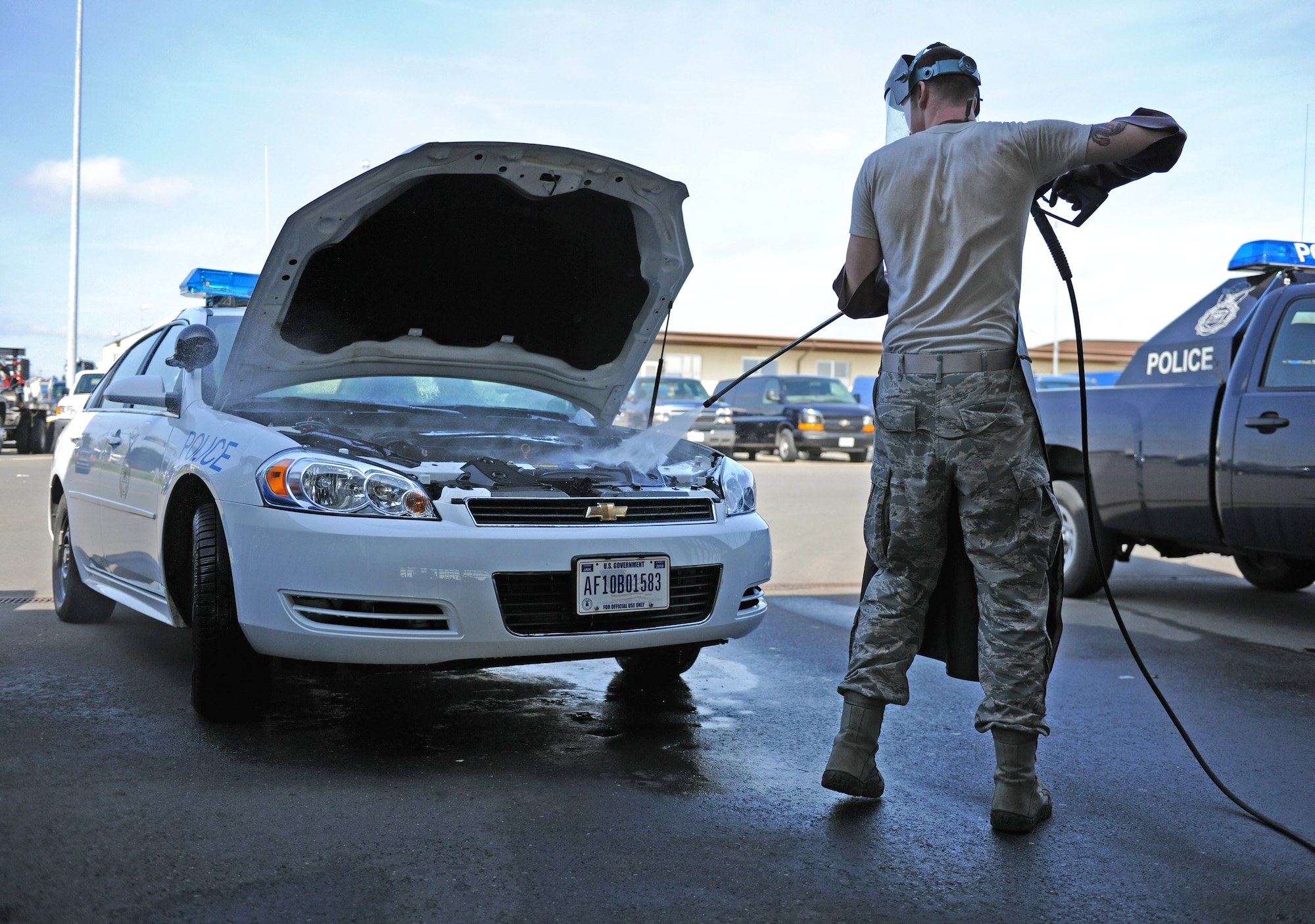 SPANGDAHLEM AIR BASE, Germany – Senior Airman Randy Johnson, 52nd Logistics Readiness Squadron base vehicle maintenance technician, cleans the engine on a security forces squad car here April 6. The 52nd LRS vehicle Maintenance Flight is responsible for the maintenance and repair of all government-owned vehicles on base. (U.S. Air Force photo/Senior Airman Nathanael Callon)