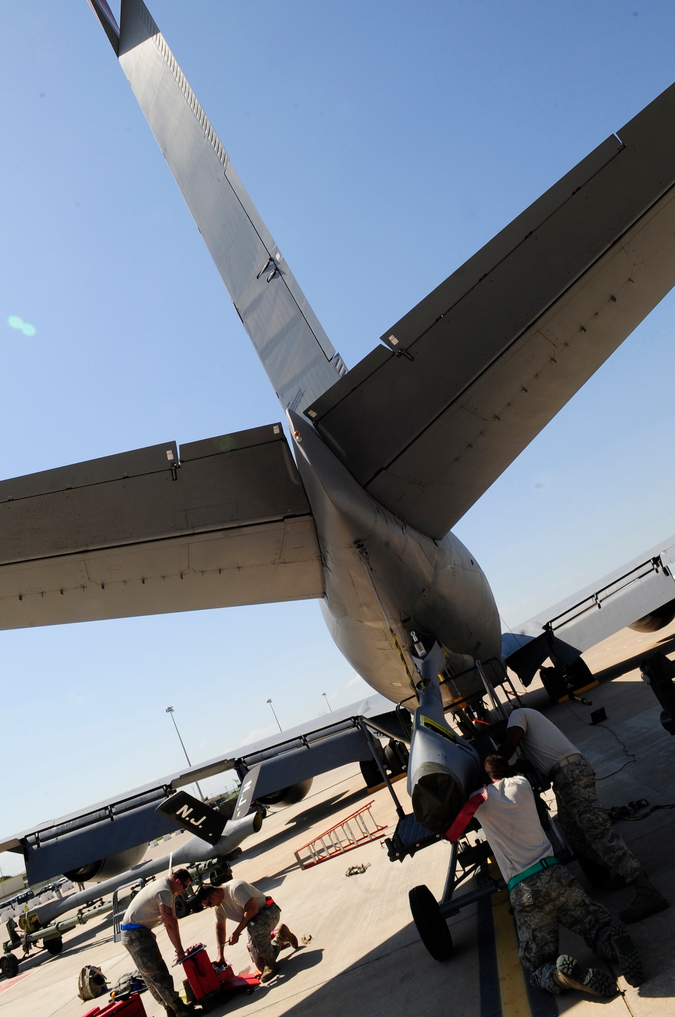 WESTERN EUROPE (April 12, 2011) -- Airmen deployed from the 171st Air Refueling Wing, Pennsylvania Air National Guard, check the ruddervator panels of a replacement boom for a KC-135 Stratotanker after attaching it to the plane in support of Operation Unified Protector. Assigned to the 313th Air Expeditionary Wing, the Airmen are supporting Operation Unified Protector, a NATO-led mission in Libya, to protect civilians and civilian-populated areas under threat of attack. The 313th AEW provides aerial refueling to U.S. and coalition aircraft with KC-135 Stratotankers and KC-10 Extenders.  (U.S. Air Force photo/Senior Airman Ethan Morgan)