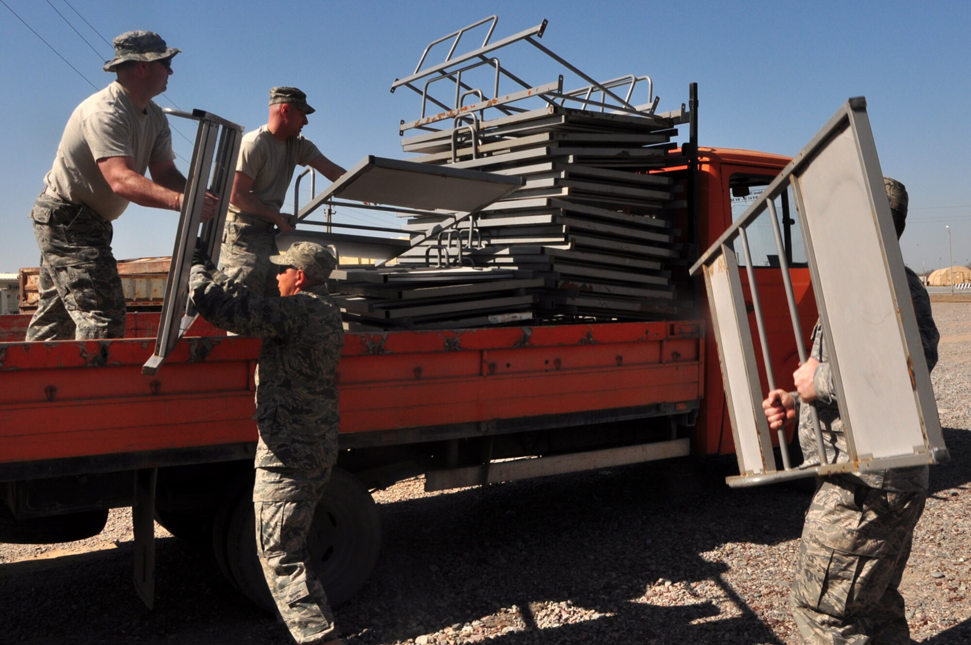 Volunteers from the Transit Center at Manas load up a truck with bunk beds headed for donation to the School for the Deaf April 13. The Theater Security Cooperation division here facilitated the transfer of approximately 140 bunk bed units and 70 mattresses were deemed excess property by the Defense Reutilization and Marketing Office. The School for the Deaf takes in and boards hearing impaired children from all-over Kyrgyzstan teaching them both general and specialized subjects including sign language.