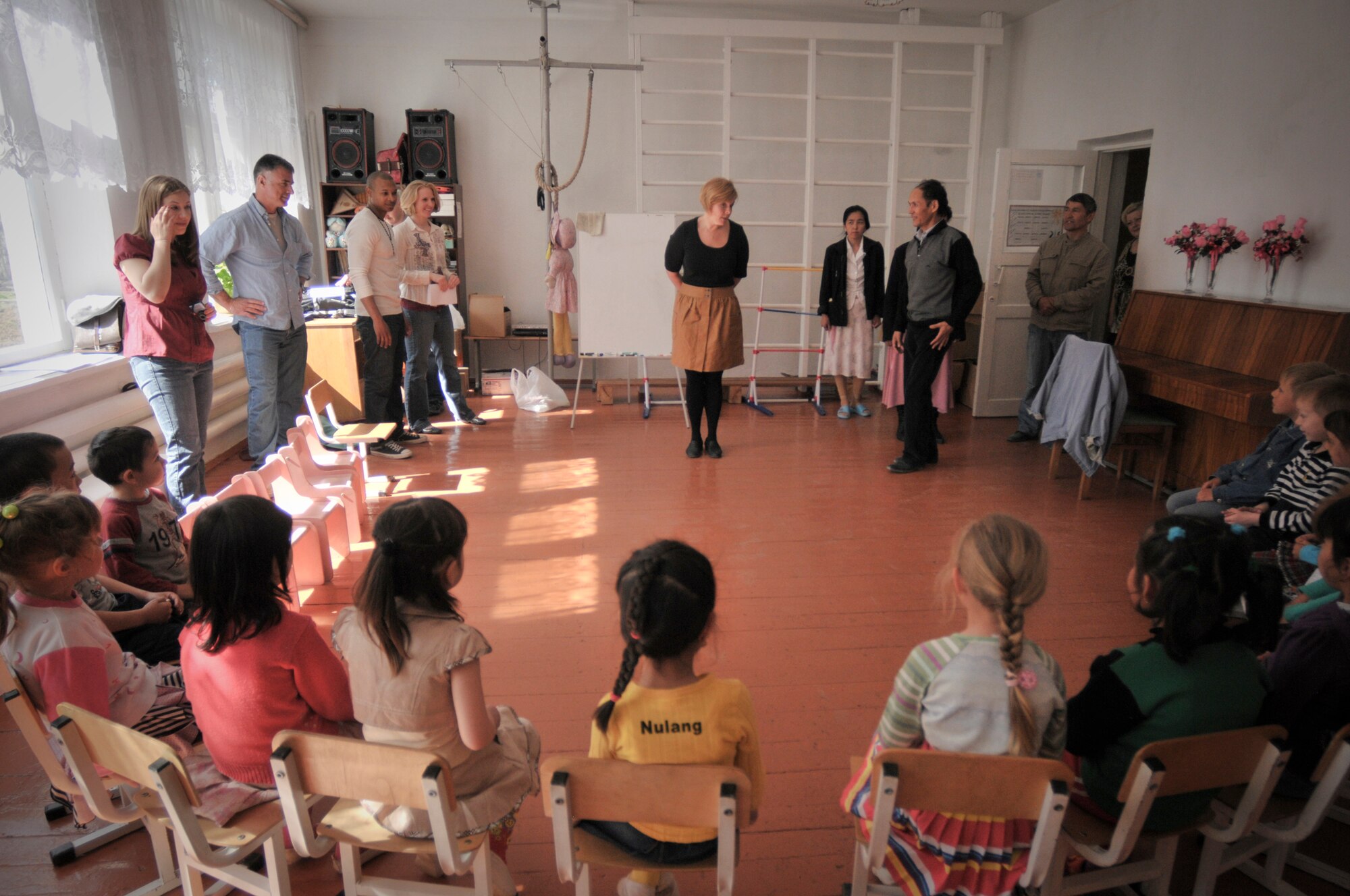 TRANSIT CENTER AT MANAS, Kyrgyzstan  - Members from the Transit Center at Manas meet with children from the Vasilievka school in Vasilievka village  as a part of a Dental outreach mission April 12.  Dental personnel demonstrated the correct way to brush and floss, what kinds of foods are good or bad for teeth and even played a few fun games designed to teach them about teeth. They also donated 90 kits with floss, toothpaste, and tooth brushes, the Civil Air Patrol also donated over 900 dollars and 50 pounds worth of toys and supplies to the school. (U.S. Air Force photo/Staff Sgt. Stacy Moless)


