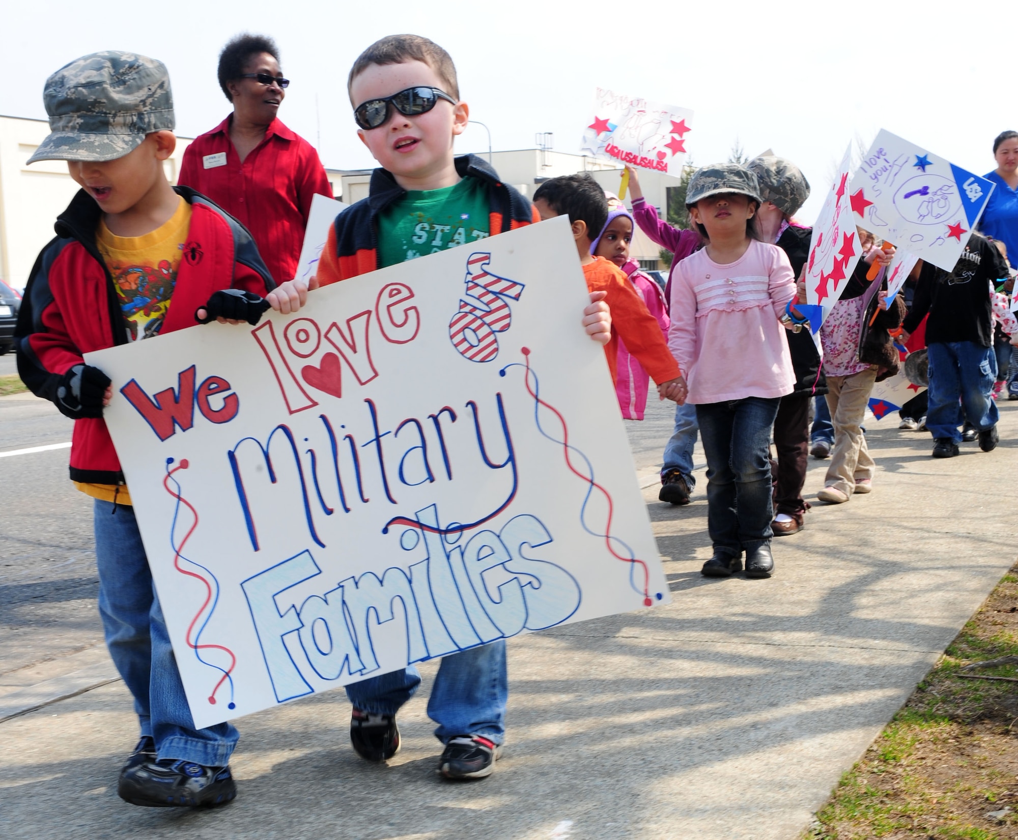 MISAWA AIR BASE, Japan--Parents, children and faculty members from Yoiko Child Development Center walk during a fun walk April 13. The contributions of military children will be celebrated across the Defense Department as April is designated as Month of the Military Child. The Month of the Military Child was established to recognize the essential role that military child care services and youth activities play in fostering readiness and enhancing the quality of life of military families. It is also a time to recognize the contributions, sacrifices and stressors military children endure.  Secretary of Defense Caspar Weinberger established the commemoration in 1986. (U.S Air Force photo/ Senior Airman Chelsea Cummings)