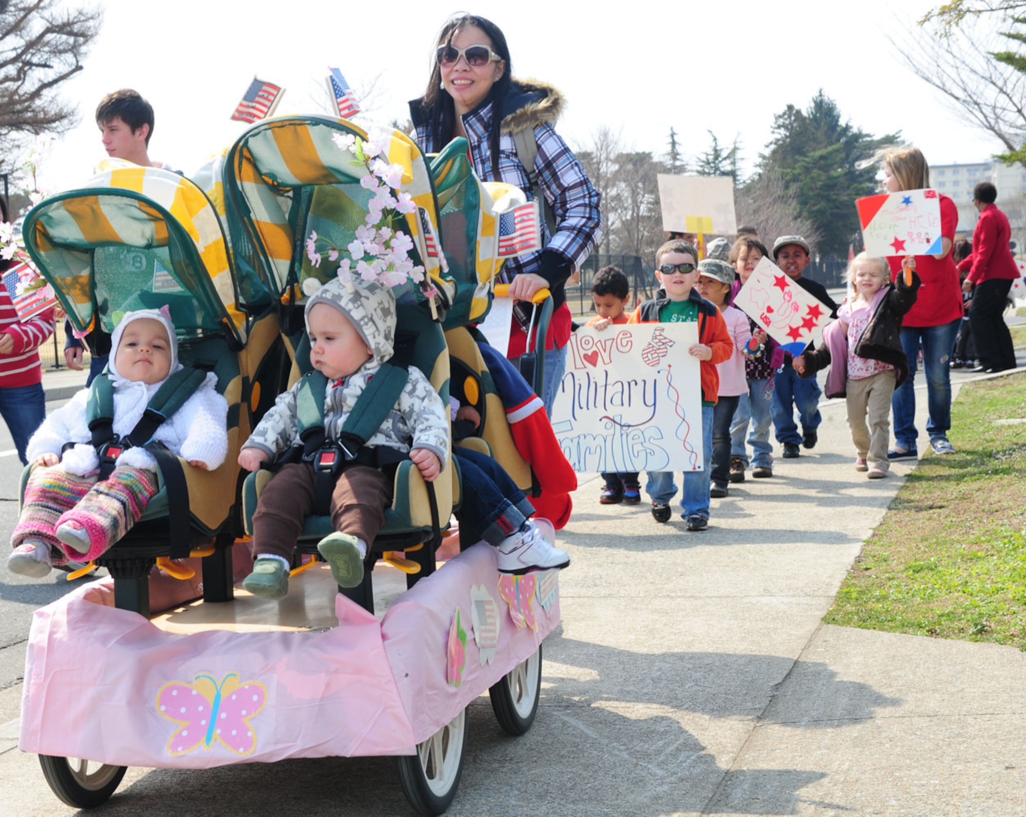 MISAWA AIR BASE, Japan--Parents, children and faculty members from Yoiko Child Development Center walk during a fun walk April 13. The contributions of military children will be celebrated across the Defense Department as April is designated as Month of the Military Child. The Month of the Military Child was established to recognize the essential role that military child care services and youth activities play in fostering readiness and enhancing the quality of life of military families. It is also a time to recognize the contributions, sacrifices and stressors military children endure.  Secretary of Defense Caspar Weinberger established the commemoration in 1986. (U.S Air Force photo/ Senior Airman Chelsea Cummings)