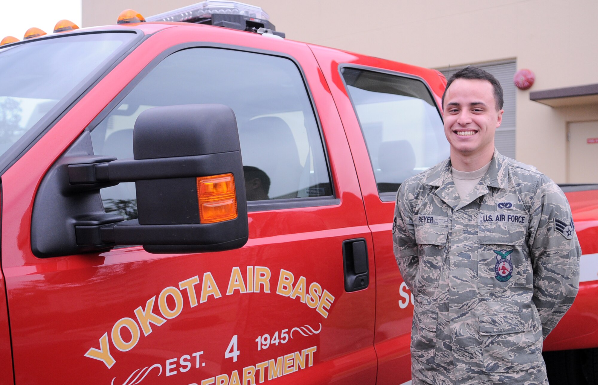 YOKOTA AIR BASE, Japan -- Senior Airman Peter Beyer, 374th Civil Engineer Squadron firefighter, poses for a photo at Yokota Air Base, Japan April 8, 2011. Airman Beyer, a native of Keaav, Hawaii, says monthly trainings have prepared him for the support he provides during Operation Tomodachi. (U.S. Air Force photo/Airman 1st Class Krystal M. Garrett)  