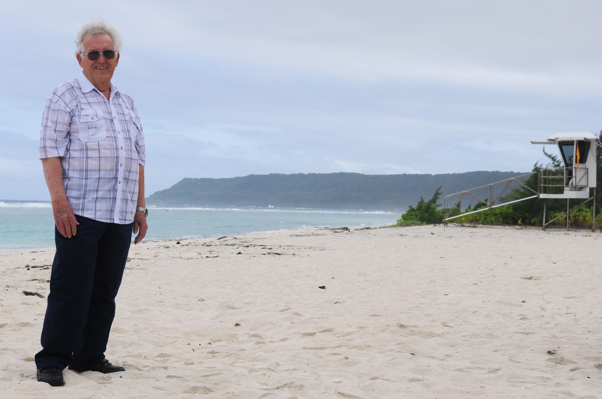 Eldred Pearson, an Air Force veteran, poses for a photo on Tarague Beach here during a visit April 11. Mr. Pearson was stationed here from 1954-1956, as part of the 3rd Aviation Support Depot working with munitions. (U.S. Air Force photo/Senior Airman Carlin Leslie)
