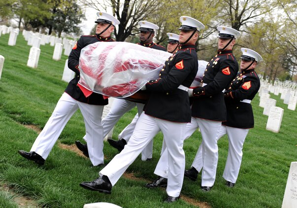 Marine Corps Body Bearers carry the casket of Col. Barry Zorthian, 1920-2010, to the grave site at Arlington National Cemetery April 13, 2011.