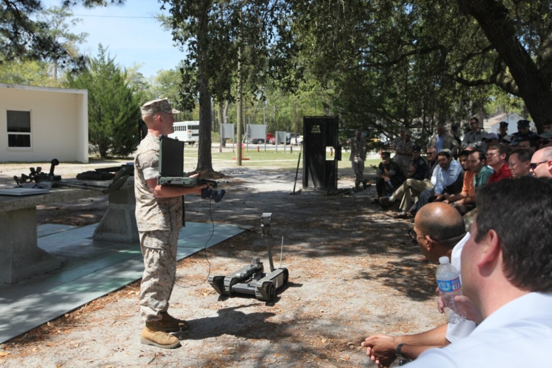 MARINE CORPS BASE CAMP LEJEUNE, N.C. – Members of the Society of American Military Engineers get a class on how the PackBot, a robot designed to cross rough terrain and with its cameras and claws identify explosive hazards, during a visit to the Marine Corps Engineer School, at Courthouse Bay, aboard Marine Corps Base Camp Lejeune, April 14. Throughout the day they got a tour of what engineers in the Marine Corps do on a daily basis.