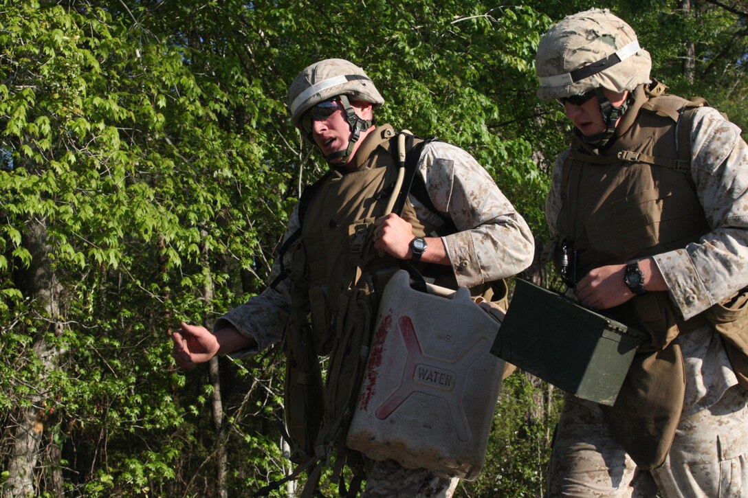 Combat instructors with Marine Combat Training Battalion, School of Infantry – East run 1.5 miles carrying water jugs and ammo cans during the second annual MCT Combat Instructor Competition aboard Camp Geiger, April 14. The competition is a two-day event designed to test the combat instructors both physically and mentally and better prepare them in teaching the MCT students.