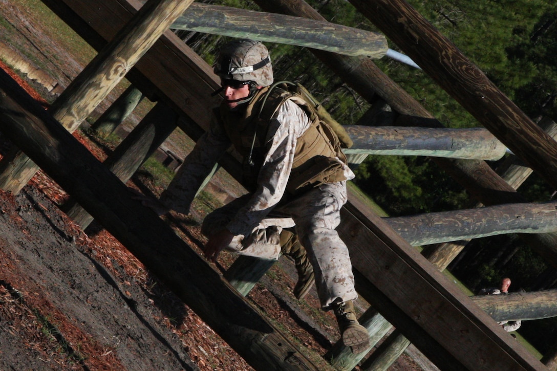 A combat instructor with Marine Combat Training Battalion, School of Infantry – East navigates through the obstacle course during the second annual MCT Combat Instructor Competition aboard Camp Geiger, April 14. The competition is a two-day event designed to test the combat instructors both physically and mentally and better prepare them in teaching the MCT students.