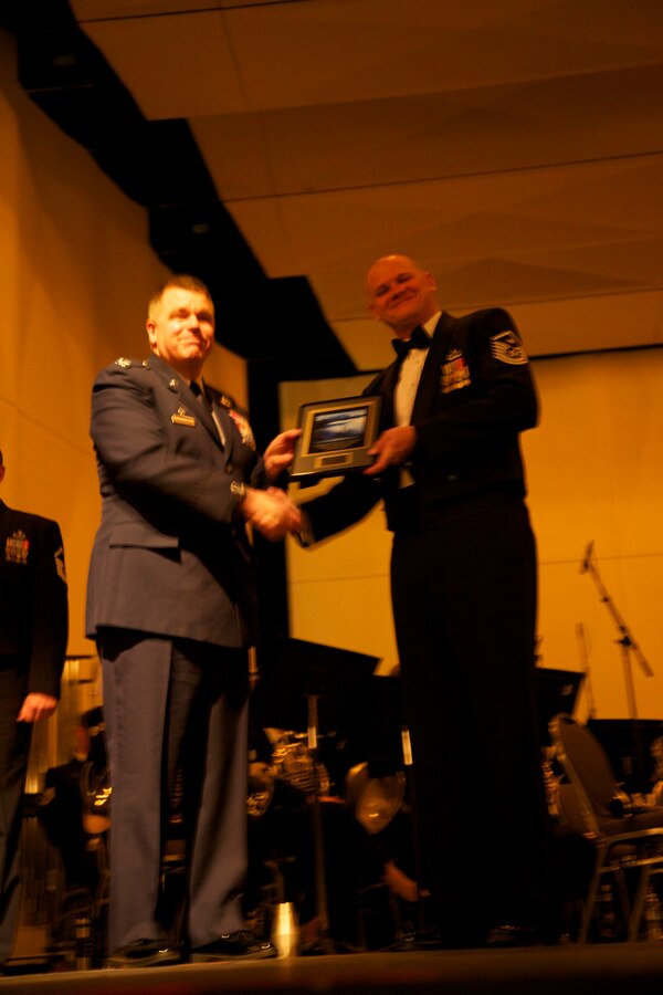 First Sergeant Bill Swanberg receives the Illinois First Sergeant of the Year award from 182 AW commander Col. Robertson.  Photo taken at the 2011 IMEA Opening Gala Concert.