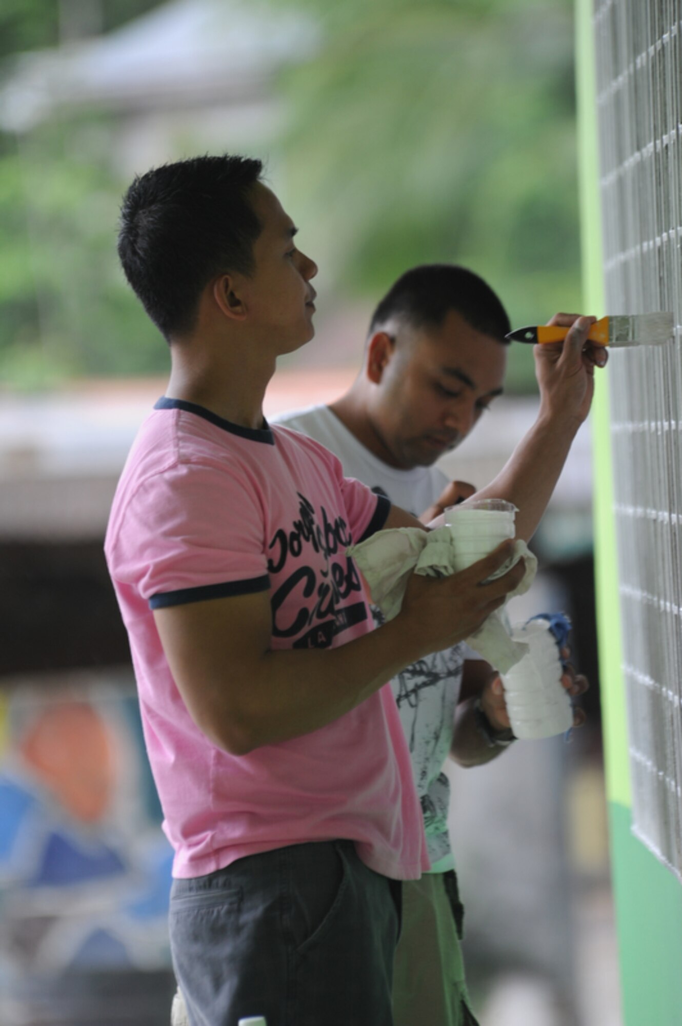 SAPANG BATO, Angeles City, Philippines - Staff Sgt. Muriel Diaz (left), a
native of Dededo Guam and currently assigned to the 36th Force Support
Squadron, Andersen Air Force Base, Guam, and Hatfield, Pa. native, Staff
Sgt. Jaimin Patel of the 554 Redhorse Squadron, Andersen AFB, Guam paint the
window panes of a school building while they and other Airmen paint the
Sapang Bato Elementary School located in Angeles City Philippines on April
9. The Airmen pulled their own money together in order to buy painting
supplies and then took a break from Balikatan 2011 to volunteer and spread
good will to the Sapang Bato community.

Balikatan is a regularly scheduled exercise focusing on interoperability of
forces and training and assistance in humanitarian and civic assistance
operations. The experience gained in Balikatan complements our security
assistance program and will improve upon existing AFP counter-terrorism
programs.  (U.S.  Air Force photo/Master Sgt. Cohen A. Young)