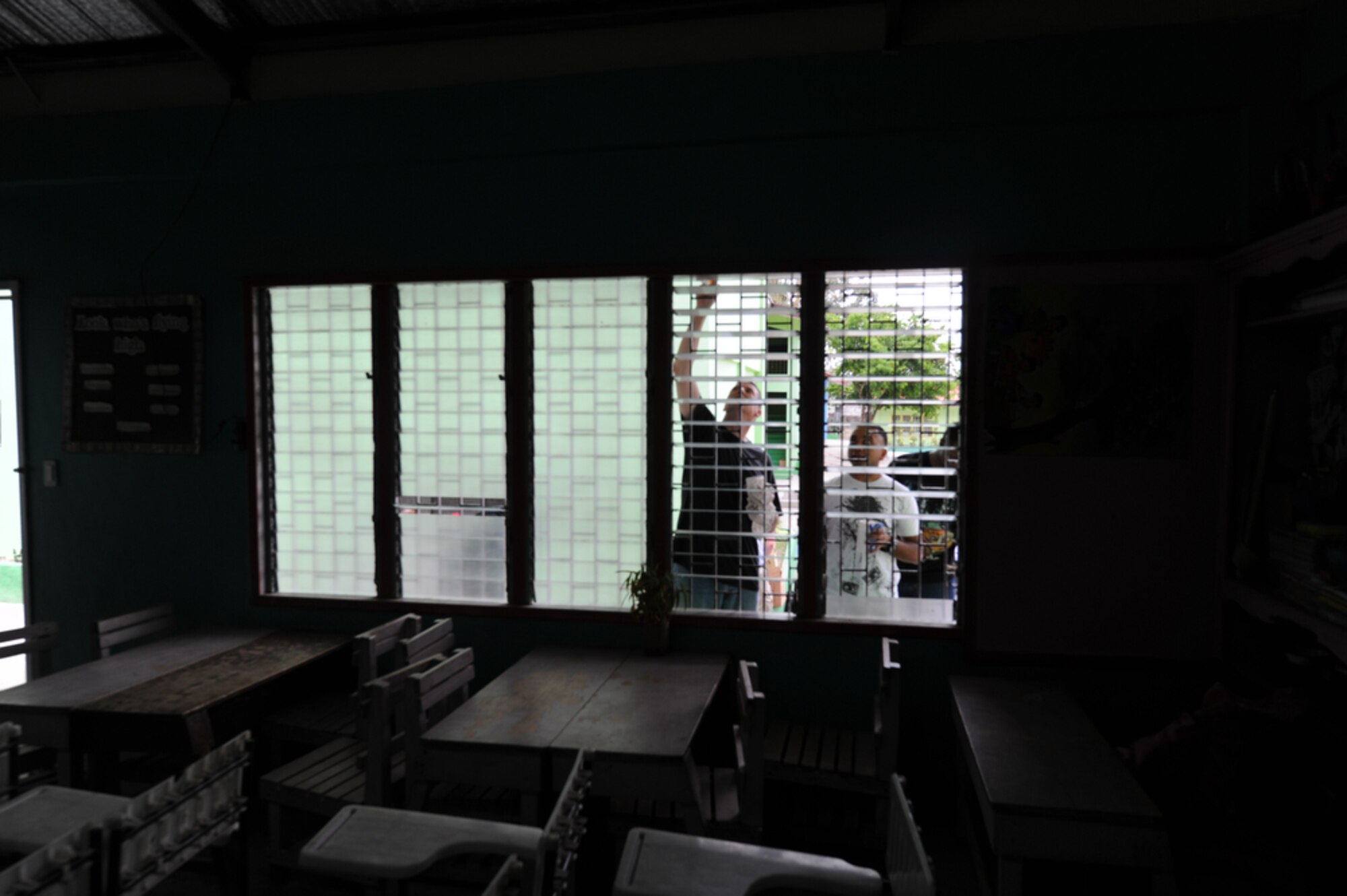 SAPANG BATO, Angeles City, Philippines - Lynchburg, Va. native, Master Sgt.
William Hudson (left) of the 673 Force Support Squadron, Elmendorf AFB,
Alaska and Hatfield, Pa. native, Staff Sgt. Jaimin Patel of the 554 Redhorse
Squadron, Andersen AFB, Guam paints the window panes of a school building
while they and other Airmen paint the Sapang Bato Elementary School located
in Angeles City Philippines on April 9. The Airmen pulled their own money
together in order to buy painting supplies and then took a break from
Balikatan 2011 to volunteer and spread good will to the Sapang Bato
community.

Balikatan is a regularly scheduled exercise focusing on interoperability of
forces and training and assistance in humanitarian and civic assistance
operations. The experience gained in Balikatan complements our security
assistance program and will improve upon existing AFP counter-terrorism
programs.  (U.S.  Air Force photo/Master Sgt. Cohen A. Young)