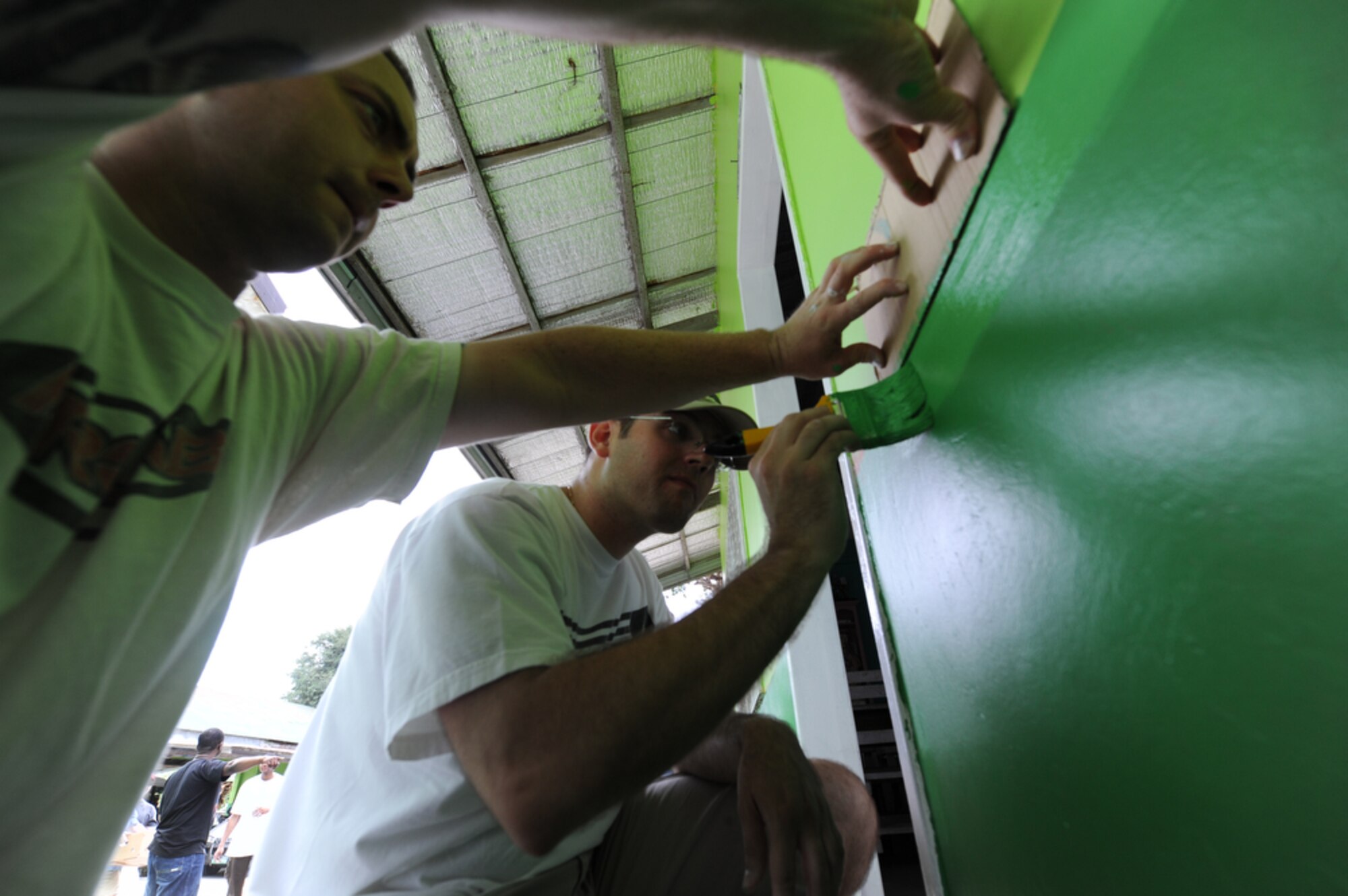 SAPANG BATO, Angeles City, Philippines - Lakeland, Fla. native, Staff Sgt.
Randy Webster (right), 51st Maintenance Group, Osan Air Base, ROK,  and
Fulda, Germany native, Staff Sgt. Thomas Morgan of the 644th Combat
Communications Squadron, Andersen AFB, Guam combine together to paint a
steady line while they and 42 other Airmen paint two buildings of the Sapang
Bato Elementary School located in Angeles City Philippines on April 9. The
Airmen pulled their own money together in order to buy painting supplies and
then took a break from Balikatan 2011 to volunteer and spread good will to
the Sapang Bato community.

Balikatan is a regularly scheduled exercise focusing on interoperability of
forces and training and assistance in humanitarian and civic assistance
operations. The experience gained in Balikatan complements our security
assistance program and will improve upon existing AFP counter-terrorism
programs.  (U.S.  Air Force photo/Master Sgt. Cohen A. Young)