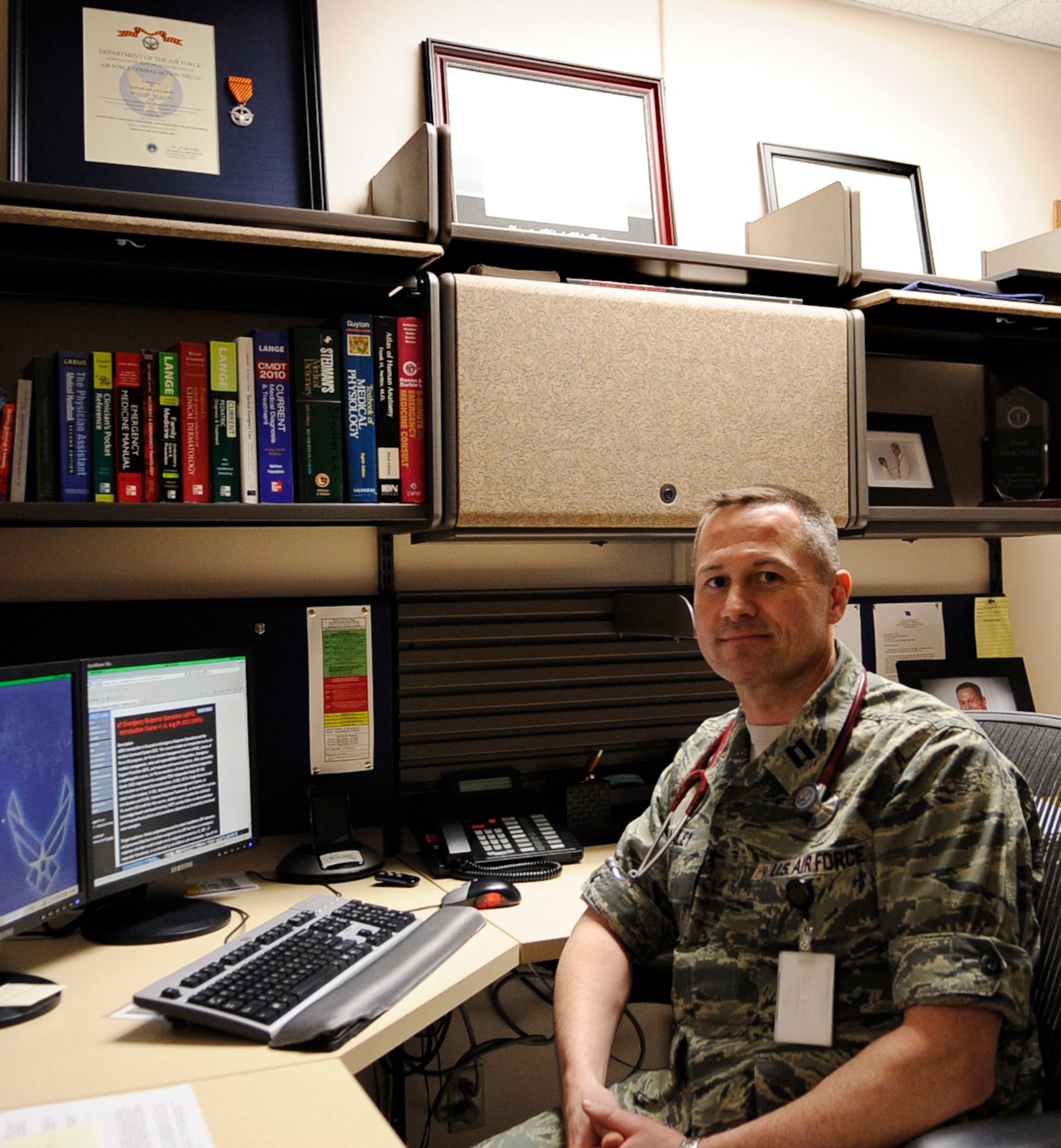 Capt. Jon Farley takes a quick break in-between seeing patients April 11, 2011, Eielson Air Force Base, Alaska. Through assistance from medical professionals and loved ones, Captain Farley has returned to a normal way of life after being diagnosed with Post Traumatic Stress Disorder. Captain Farley is a physician's assistant assigned to the 354th Medical Operations Squadron. (U.S. Air Force photo/Airman 1st Class Laura Goodgame) 