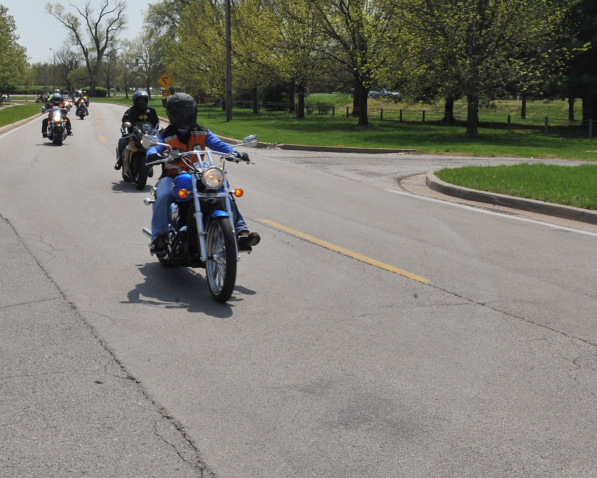 Motorcyclists take a morale ride around base at the end of the Motorcycle Safety Day at Scott Air Force Base, Ill., April 14, 2011. The day helped bring riders together to show off their motorcycles and get to know one another while letting everyone ride together in the end.  (U.S. Air Force photo/Senior Airman Tristin English)