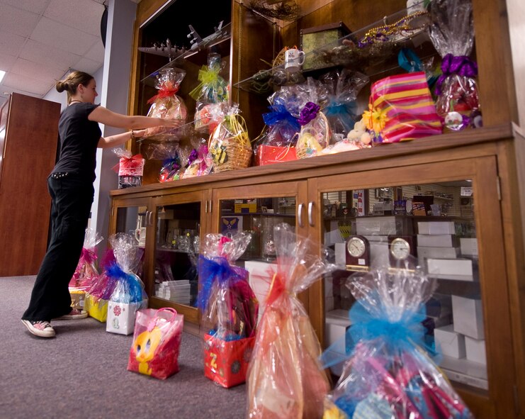 Recreational aid Mariah Gilbert, 2nd Force Support Squadron, places an Easter basket on the shelf at the arts & crafts center on Barksdale Air Force Base, La., April 14. The arts & crafts center has a variety of baskets available for purchase and will continue selling them until April 22. (U.S. Air Force photo/Senior Airman Chad Warren)(RELEASED)