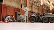 MOODY AIR FORCE BASE, Ga.-- Students of Moody’s first-ever first responder’s course treat a trauma victim as an instructor evaluates their performance April 13. Eight members from the 93rd Air Ground Operations Wing were hand selected to attend the first course. (U.S. Air Force photo/Airman 1st Class Benjamin Wiseman)(RELEASED)