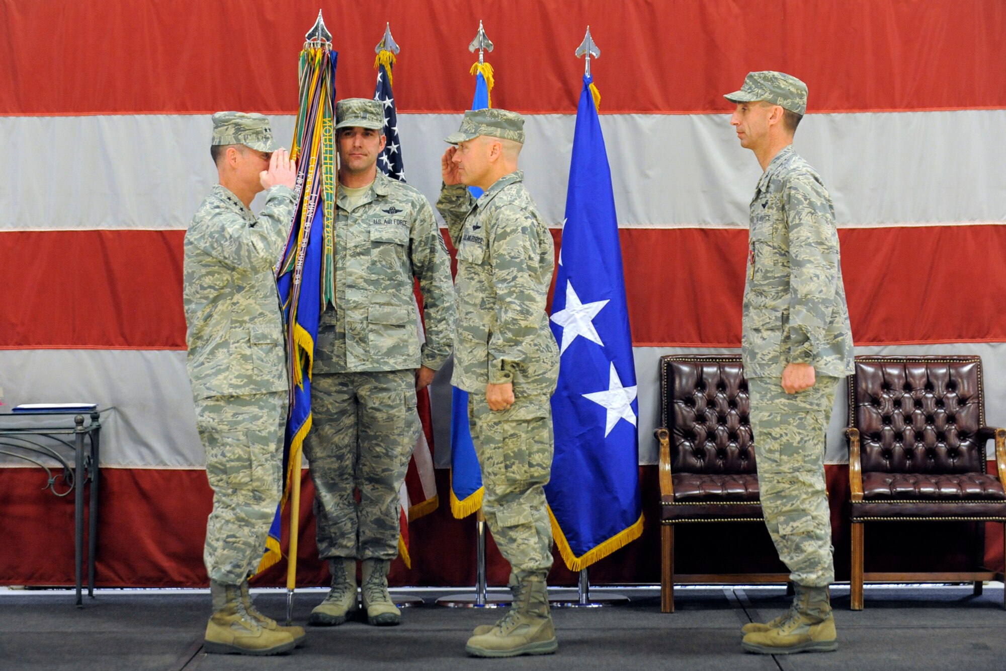 Lt. Gen. Glenn F. Spears (left), 12th Air Force commander, salutes Col. Scott Long, 388th Fighter Wing commander, at a change of command ceremony, April 7. Brig. Gen.-select Scott Zobrist, former commander, stands nearby as Chieft Master Sgt. Atticus Smith, 388th FW, holds the guidon. (U.S. Air Force photo by Todd Cromar)