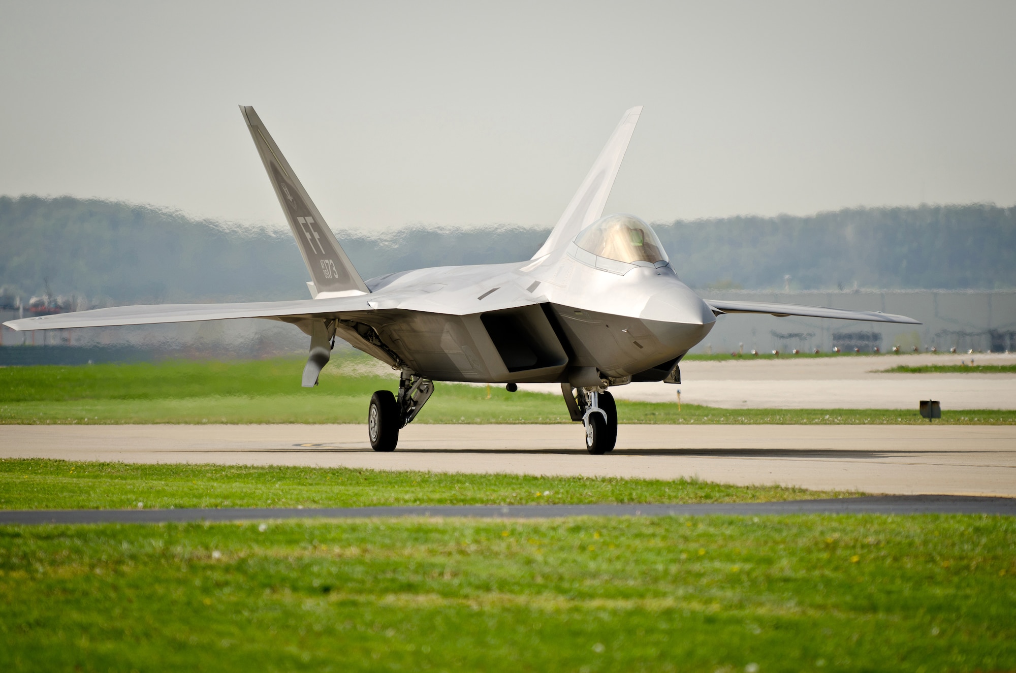 A U.S. Air Force F-22 Raptor taxies into the Kentucky Air National Guard Base in Louisville, Ky., on April 14, 2011, in preparation for the Thunder Over Louisville air show. The Raptors will be one of show?s marquee events when Thunder takes place over the Ohio River on April 16. Nearly 60 aircraft are expected to participate in Thunder. (U.S. Air Force photo by Maj. Dale Greer)