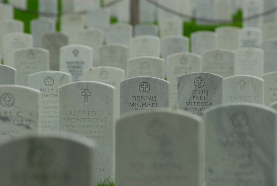 DYESS AIR FORCE BASE, Texas - Grave stones rest in alignment in Arlington National Cemetery April 12 in Arlington, Va. More than 200 World War II veterans from the Abilene Texas area visited Arlington Cemetery during a West Texas Honor Flight Network event. Audie Murphy became the most decorated U.S. Soldier of World War II during 27 months in action in the European Theater. He received the Medal of Honor, the U.S. military's highest award for valor, along with 32 additional U.S. and foreign medals and citations, including five from France and one from Belgium. The Honor Flight Network is a non-profit organization created to honor America’s veterans for their sacrifices by transporting these heroes to Washington D.C. to visit and reflect at their memorials at no cost to themselves. Honor Flight trips are made possible through donations; discounts by charter bus companies, airlines, hotels and more; and through volunteers, of which more than 100 were present during this West Texas Honor Flight. (Air Force photo/Tech. Sgt. Robert Wollenberg)