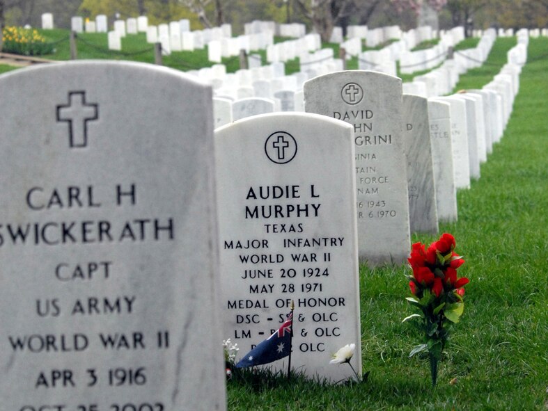 DYESS AIR FORCE BASE, Texas - Audie Murphy’s grave site sits in Arlington Cemetery April 12. More than 200 World War II veterans from the Abilene Texas area visited Arlington Cemetery during a West Texas Honor Flight Network event. Audie Murphy became the most decorated U.S. Soldier of World War II during 27 months in action in the European Theater. He received the Medal of Honor, the U.S. military's highest award for valor, along with 32 additional U.S. and foreign medals and citations, including five from France and one from Belgium. The Honor Flight Network is a non-profit organization created to honor America’s veterans for their sacrifices by transporting these heroes to Washington D.C. to visit and reflect at their memorials at no cost to themselves. Honor Flight trips are made possible through donations; discounts by charter bus companies, airlines, hotels and more; and through volunteers, of which more than 100 were present during this West Texas Honor Flight. (Air Force photo/Tech. Sgt. Robert Wollenberg)