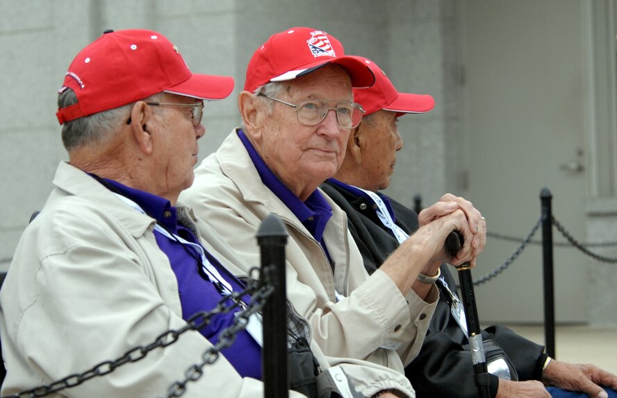DYESS AIR FORCE BASE, Texas - World War II veterans reflect on times past while visiting the World War II Memorial in Washington D.C. April 12 as part of a West Texas Honor Flight Network event. The Honor Flight Network is a non-profit organization created to honor America’s veterans for their sacrifices by transporting these heroes to Washington D.C. to visit and reflect at their memorials at no cost to themselves. Honor Flight trips are made possible through donations; discounts by charter bus companies, airlines, hotels and more; and through volunteers, of which more than 100 were present during this West Texas Honor Flight. (Air Force photo/Tech. Sgt. Robert Wollenberg)