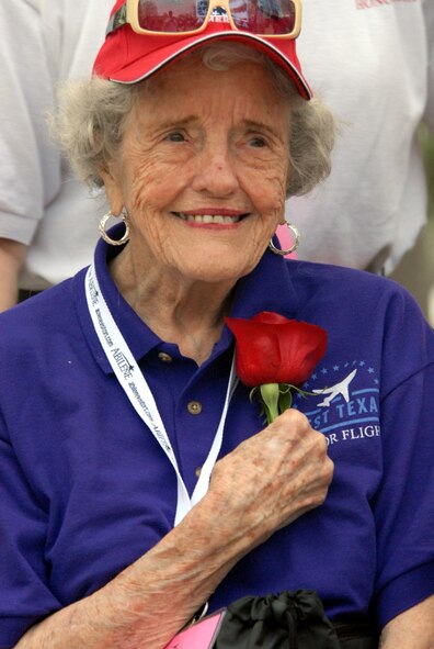 DYESS AIR FORCE BASE, Texas - One of more than 200 World War II veterans enjoys a rose while visiting the World War II Memorial in Washington D.C. April 12 as part of a West Texas Honor Flight Network event. The Honor Flight Network is a non-profit organization created to honor America’s veterans for their sacrifices by transporting these heroes to Washington D.C. to visit and reflect at their memorials at no cost to themselves. Honor Flight trips are made possible through donations; discounts by charter bus companies, airlines, hotels and more; and through volunteers, of which more than 100 were present during this West Texas Honor Flight. (Air Force photo/Tech. Sgt. Robert Wollenberg)