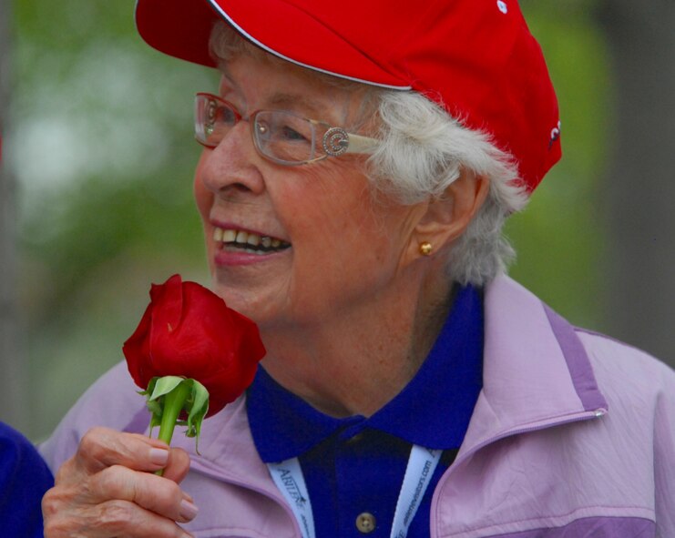 DYESS AIR FORCE BASE, Texas - One of more than 200 World War II veterans enjoys a rose while visiting the World War II Memorial in Washington D.C. April 12 as part of a West Texas Honor Flight Network event. The Honor Flight Network is a non-profit organization created to honor America’s veterans for their sacrifices by transporting these heroes to Washington D.C. to visit and reflect at their memorials at no cost to themselves. Honor Flight trips are made possible through donations; discounts by charter bus companies, airlines, hotels and more; and through volunteers, of which more than 100 were present during this West Texas Honor Flight. (Air Force photo/Tech. Sgt. Robert Wollenberg)