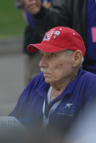DYESS AIR FORCE BASE, Texas - One of more than 200 World War II veterans reflect on times past while visiting the World War II Memorial in Washington D.C. April 12 as part of a West Texas Honor Flight Network event. The Honor Flight Network is a non-profit organization created to honor America’s veterans for their sacrifices by transporting these heroes to Washington D.C. to visit and reflect at their memorials at no cost to themselves. Honor Flight trips are made possible through donations; discounts by charter bus companies, airlines, hotels and more; and through volunteers, of which more than 100 were present during this West Texas Honor Flight. (Air Force photo/Tech. Sgt. Robert Wollenberg)