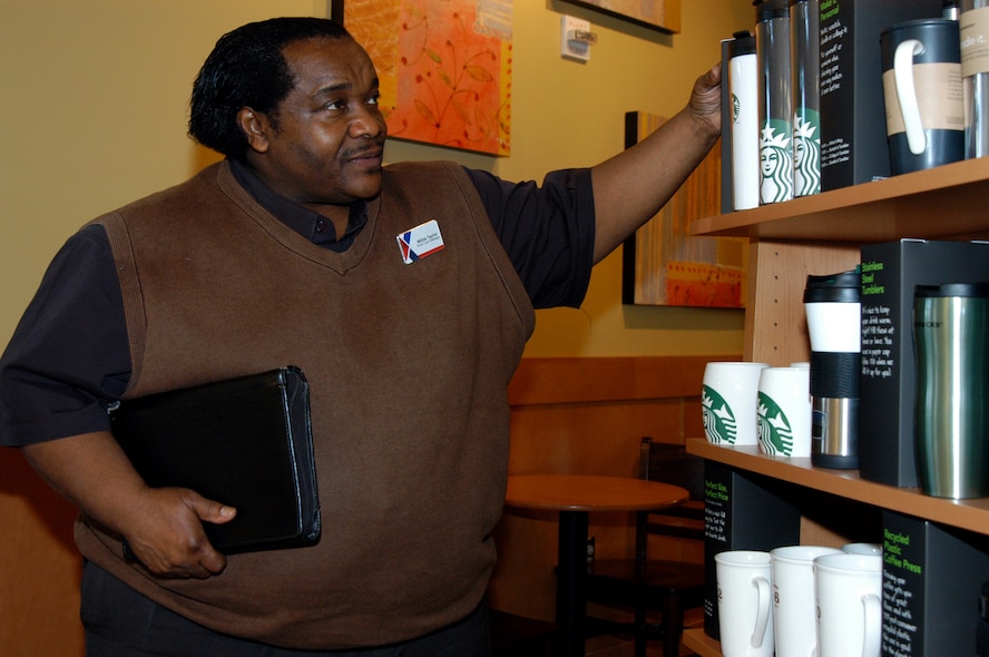 OFFUTT AIR FORCE BASE, Neb. -- Willie Taylor, the food court manager for the Offutt Exchange, inspects some merchandise at the Starbucks coffee shop inside the Base Exchange here March 16. Mr. Taylor has worked for the Army and Air Force Exchange Service for 23 years and is set to retire in April. During his AAFES career, Mr. Taylor has supported U.S. servicemembers at bases from Texas to Bosnia. He also spent 11-months supporting military members involved with Katrina relief efforts in New Orleans. U.S. Air Force photo by Staff Sgt. James M. Hodgman (Released)