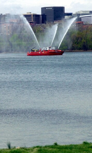 DYESS AIR FORCE BASE, Texas - A Washington D.C. fire boat salutes passing buses of more than 200 World War II veterans traveling to Washington from Abilene, Texas as part of a West Texas Honor Flight Network event. The Honor Flight Network is a non-profit organization created to honor America’s veterans for their sacrifices by transporting these heroes to Washington D.C. to visit and reflect at their memorials at no cost to themselves. Honor Flight trips are made possible through donations; discounts by charter bus companies, airlines, hotels and more; and through volunteers, of which more than 100 were present during this West Texas Honor Flight. (Air Force photo/Tech. Sgt. Robert Wollenberg)