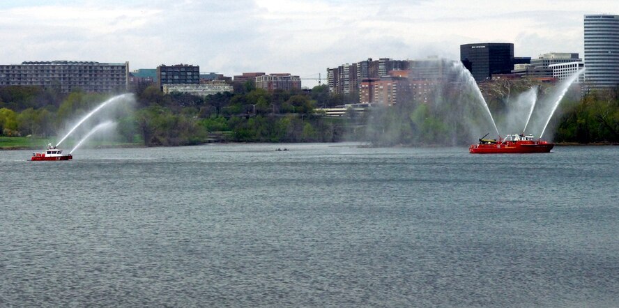 DYESS AIR FORCE BASE, Texas - Washington D.C. fire boats salute passing buses of more than 200 World War II veterans traveling to Washington from Abilene, Texas as part of a West Texas Honor Flight Network event. The Honor Flight Network is a non-profit organization created to honor America’s veterans for their sacrifices by transporting these heroes to Washington D.C. to visit and reflect at their memorials at no cost to themselves. Honor Flight trips are made possible through donations; discounts by charter bus companies, airlines, hotels and more; and through volunteers, of which more than 100 were present during this West Texas Honor Flight. (Air Force photo/Tech. Sgt. Robert Wollenberg)