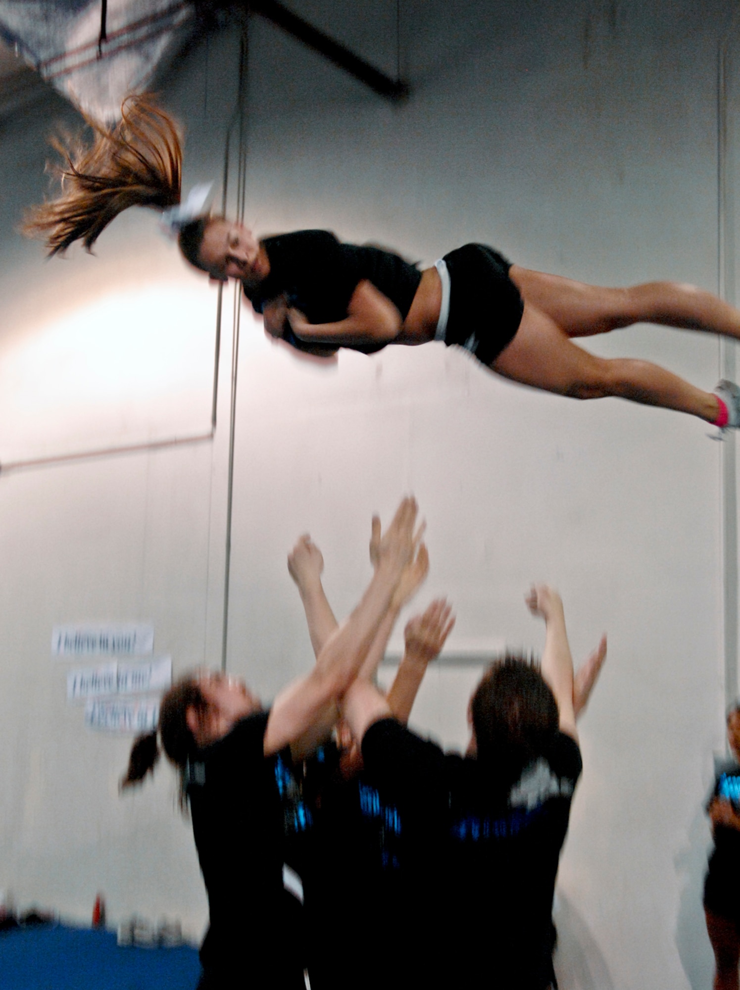 ANCHORAGE, Alaska ? Megan Cukoiya a members of the Denali Cheerleading team practice a routine with her teammates. The Denali team will be representing Alaska in the upcoming World Cheerleading competition in Orlando Fla. (U.S. Air Force photo/Airman 1st Class Jack Sanders)