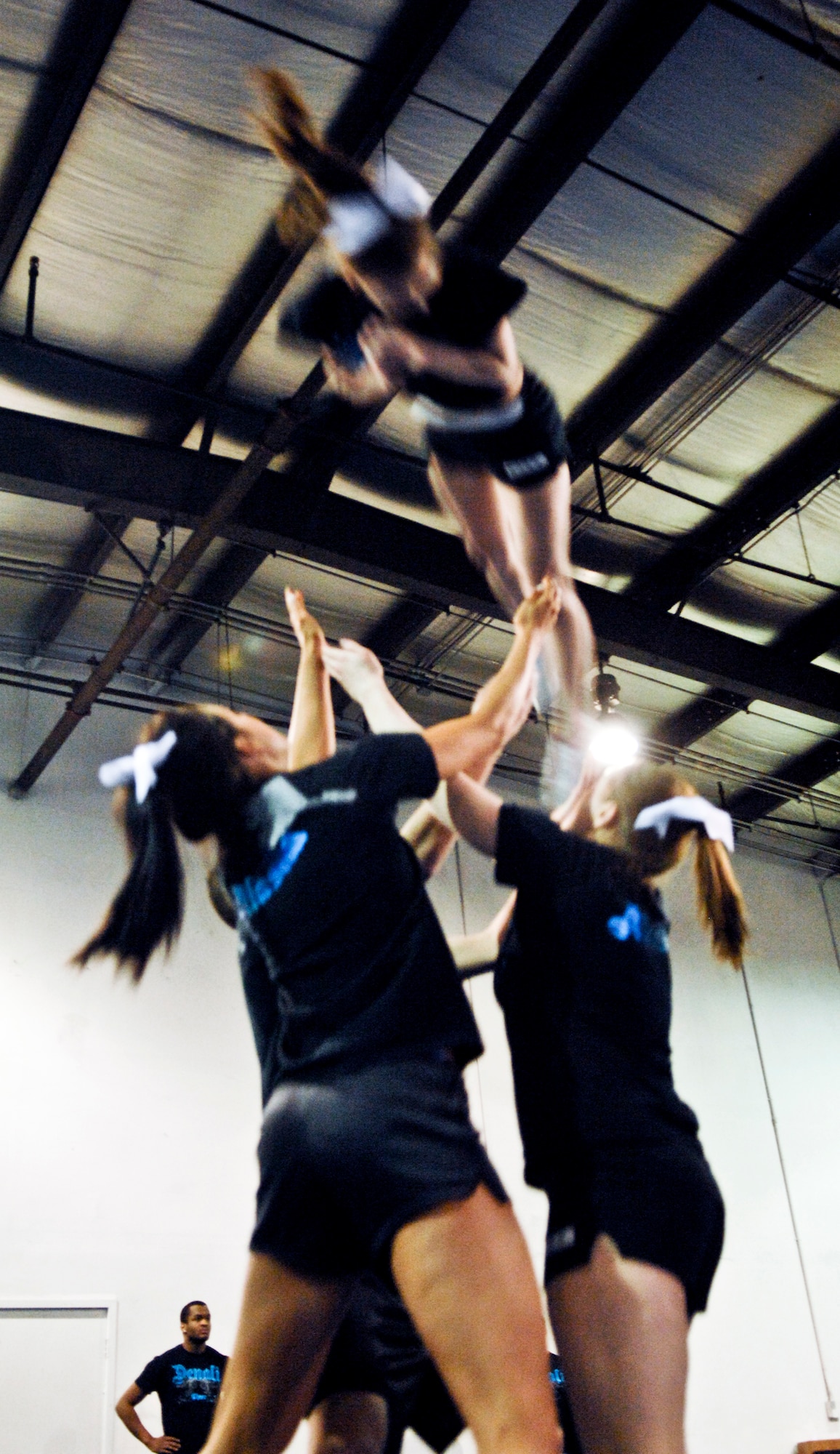 JOINT BASE ELMENDORF-RICHARDSON, Alaska --Members of the Denali Cheerleading team catch their teammate Dannie Campbell after a stunt. The Denali team will be representing Alaska in the upcoming World Cheerleading competition in Orlando Fla. (U.S. Air Force photo/Airman 1st Class Jack Sanders)