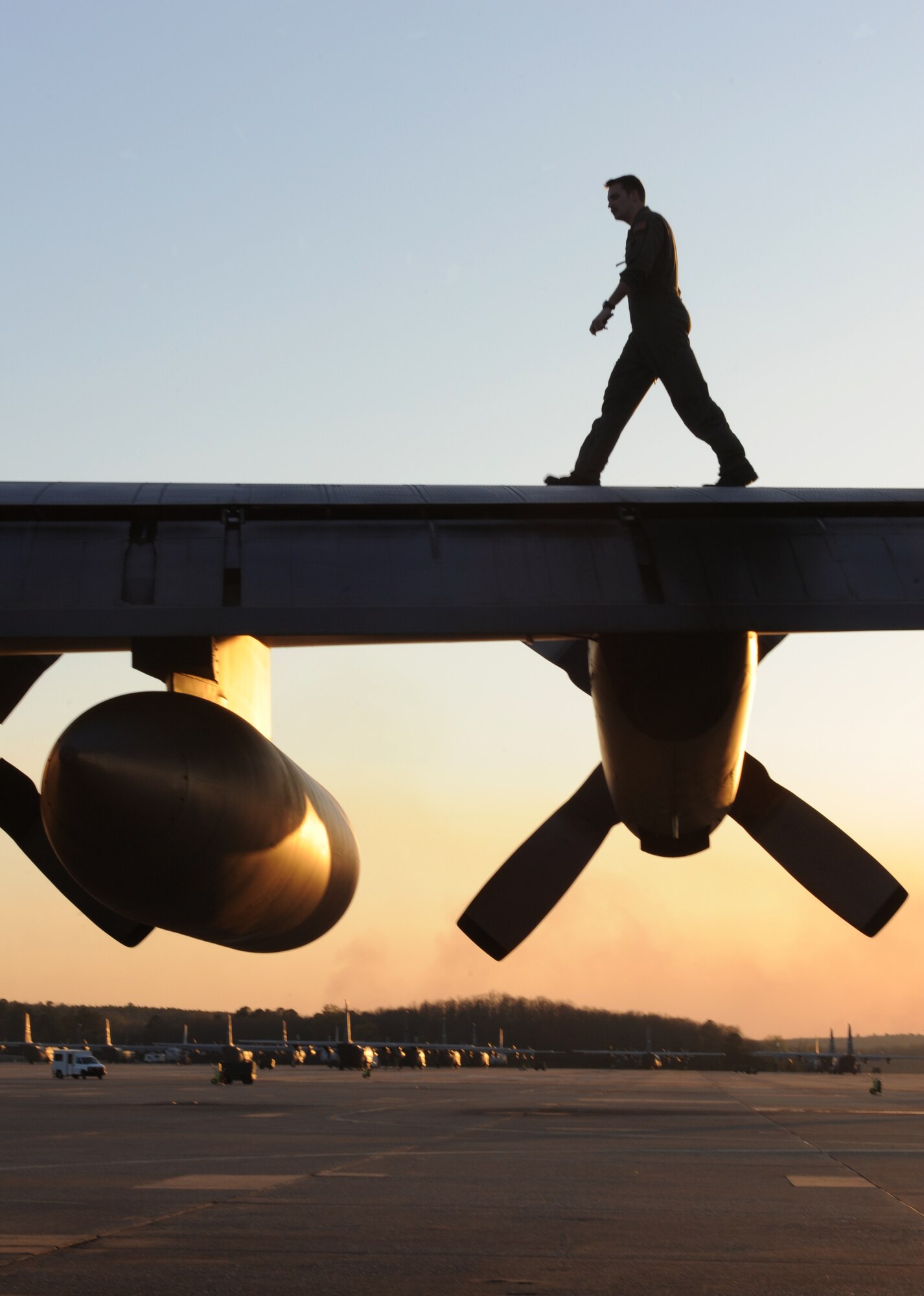 Staff Sgt. Chris Bickley, a 50th Airlift Squadron flight engineer, walks the wing of a Hercules C-130 March 24, 2011, on the flightline at Little Rock Air Force Base, Ark. Sergeant Bickley checks the C-130 wings to ensure nothing is out of order before taking off.  (Air Force photo by Airman 1st Class Ellora Stewart)