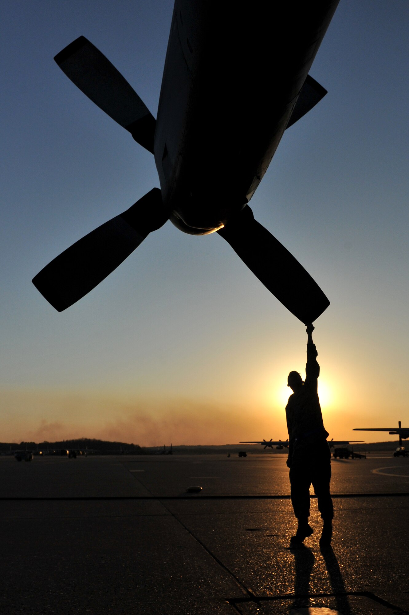 Airman 1st Class Travis Barnes, a 314th Aircraft Maintenance Squadron crew chief, performs a pre-flight check on the propeller of a C-130 Hercules March 24, 2011, at Little Rock Air Force Base, Ark. (U.S. Air Force photo by Staff Sgt. Chris Willis)