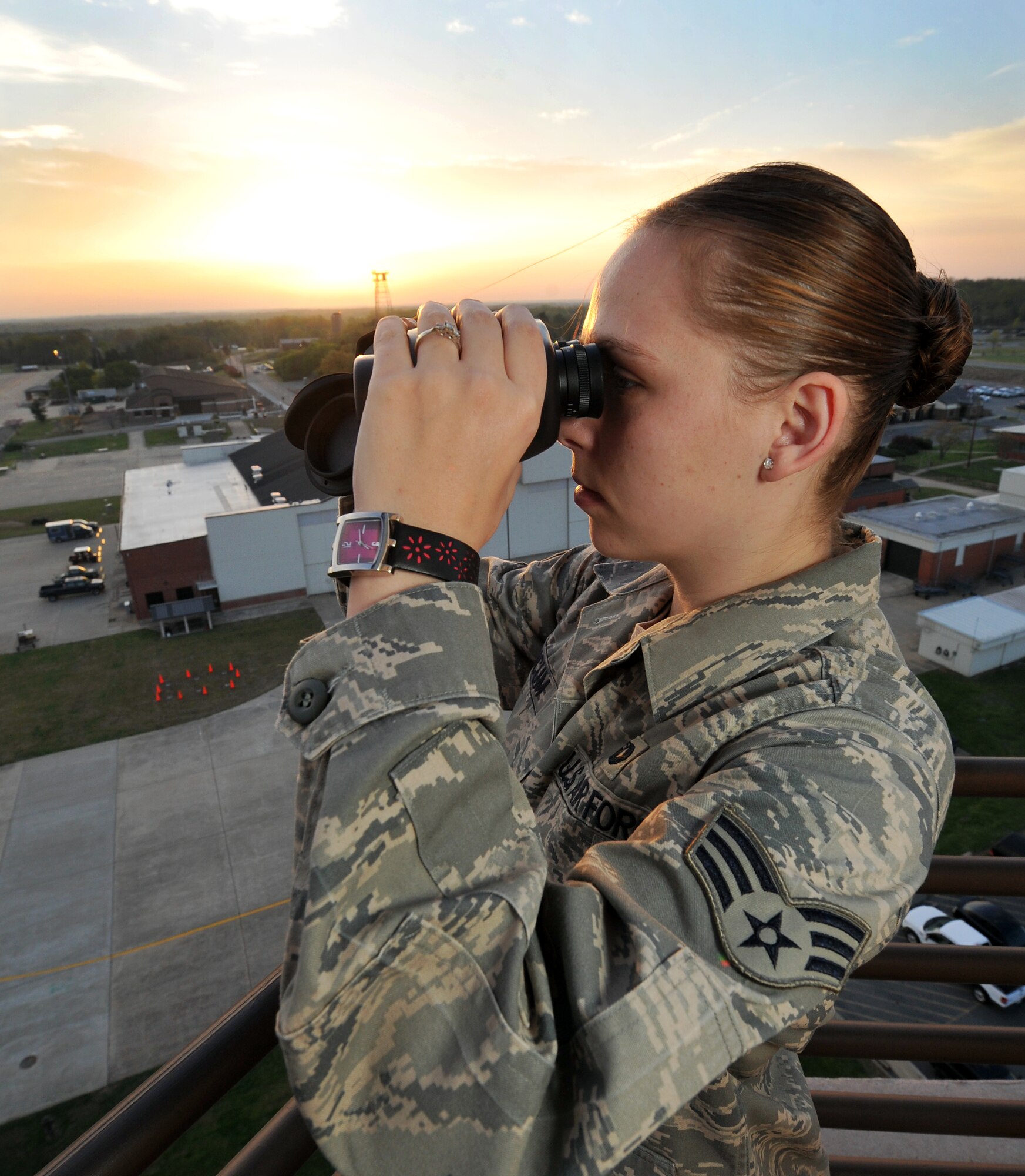 Senior Airman Ashley Baucum, a 19th Operations Squadron air traffic controller, scans the flightline April 7, 2011, from the tower at Little Rock Air Force Base Ark. The base tower oversaw more than 130,000 flying missions last year. (U.S. Air Force photo by Staff Sgt. Chris Willis)