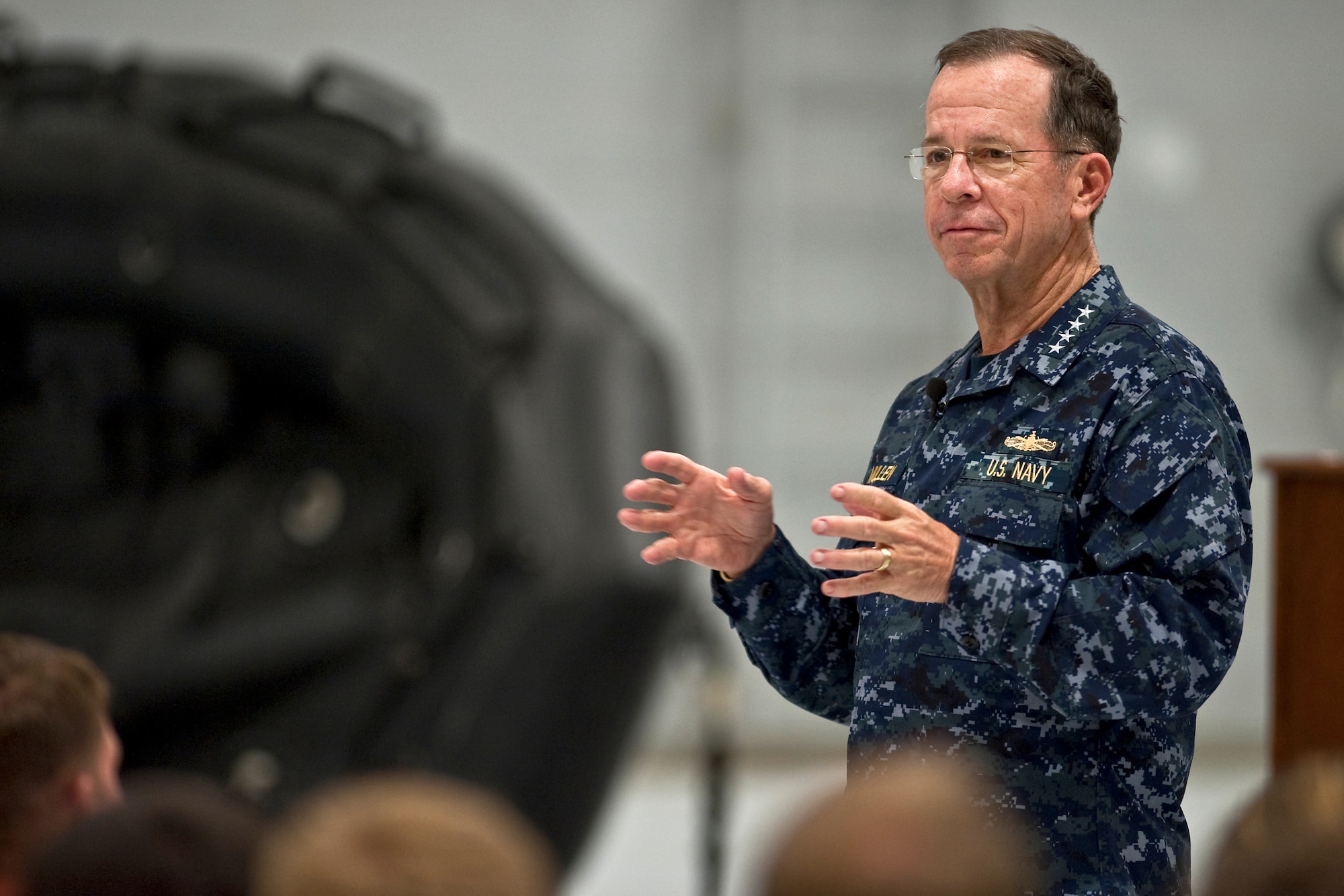 NELLIS AIR FORCE BASE, Nev. -- Chairman of the Joint Chiefs of Staff Navy Adm. Mike Mullen addresses the Nellis rescue community before awarding the Bronze Star with valor to three 58th Rescue Squadron pararescuemen April 13.  Tech. Sgt. Jeffrey Hedglin,  Tech. Sgt. Ryan Manjuck, and Staff Sgt. Asher Woodhouse all received the Bronze Star for their heroic actions while rescuing American Soldiers last year in Afghanistan. (U.S. Air Force photo by Tech. Sgt. Michael Holzworth)
