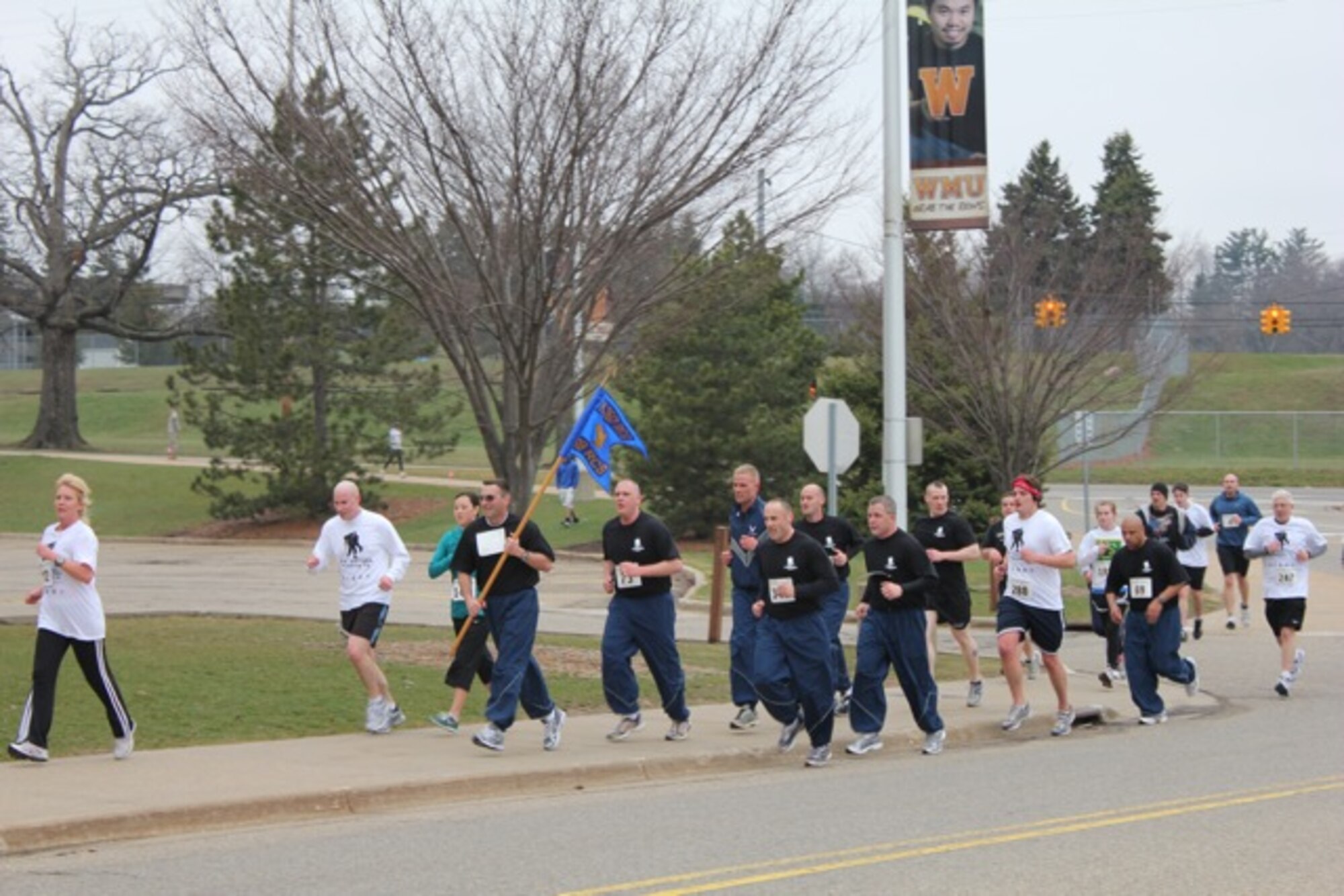 Members from the 339th Recruiting Squadron, led by its commander, Lt. Col. Wade Mueller, run in the Western Michigan University Wounded Warrior 5K. The 339th RCS ran in honor of Senior Airman James Hansen who was killed in Iraq last year. (U.S. Air Force photo/Denise McMillen)